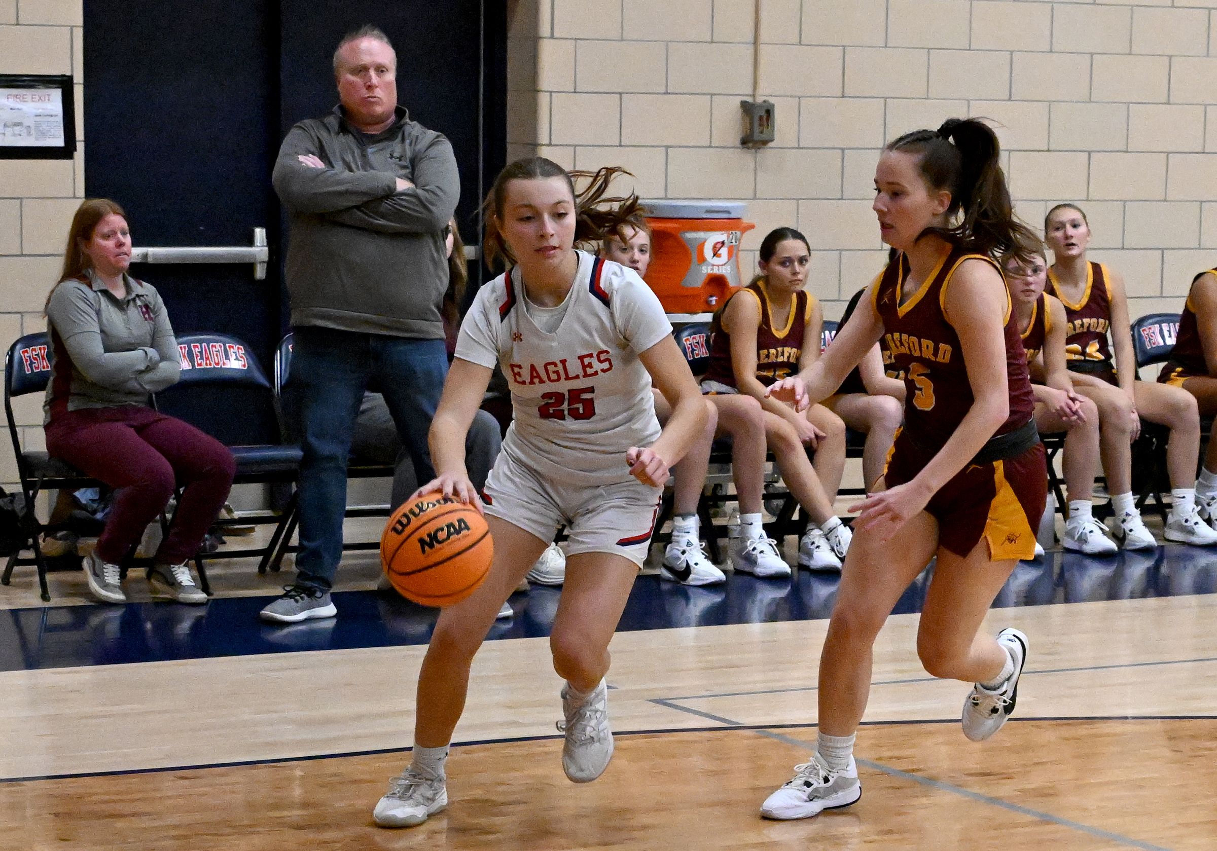 Francis Scott Key's McKenna Lanza drives past a Hereford defender...
