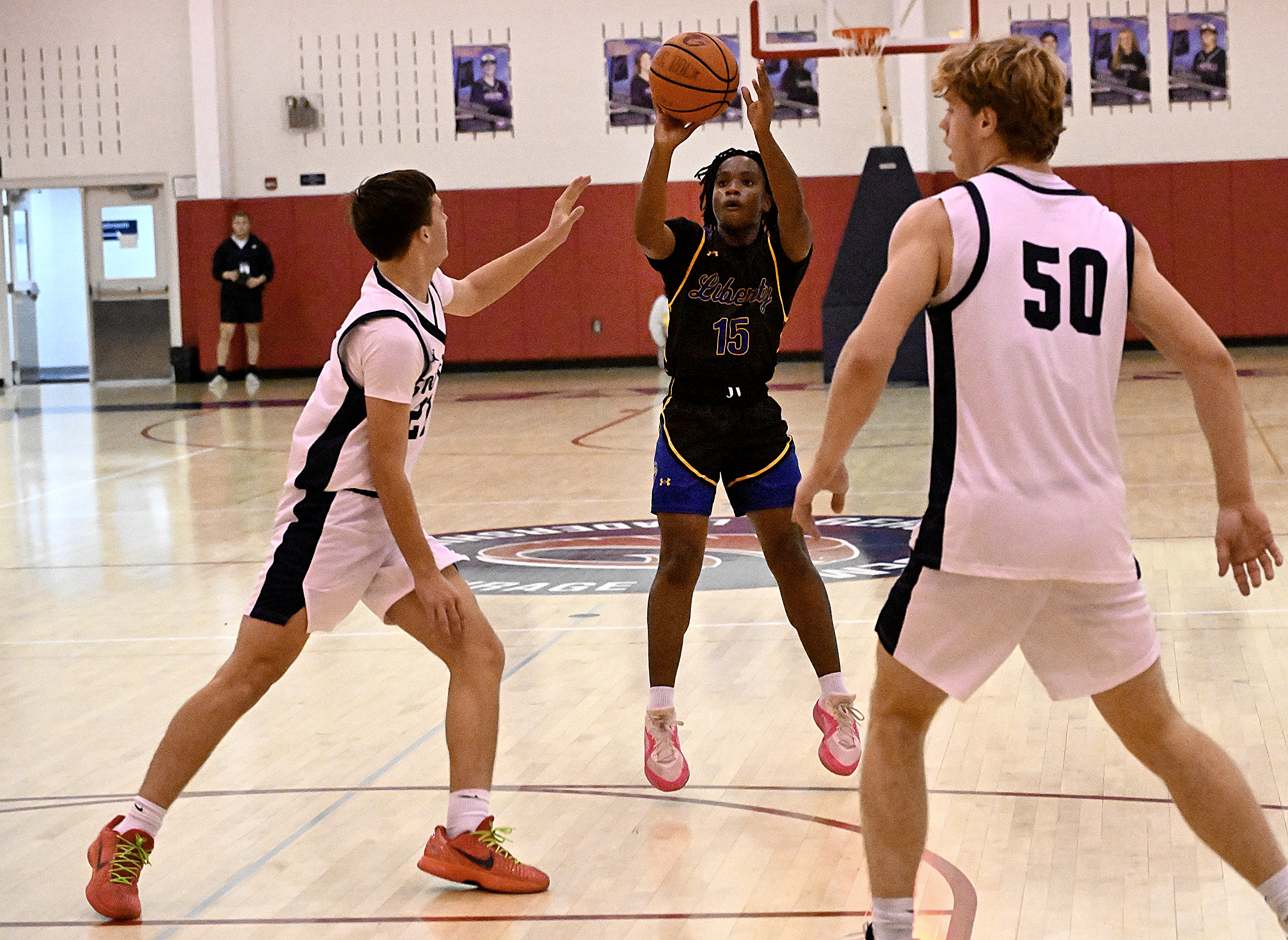 Liberty #15, Nathan Gitau pull-up jumpshot for two at the...