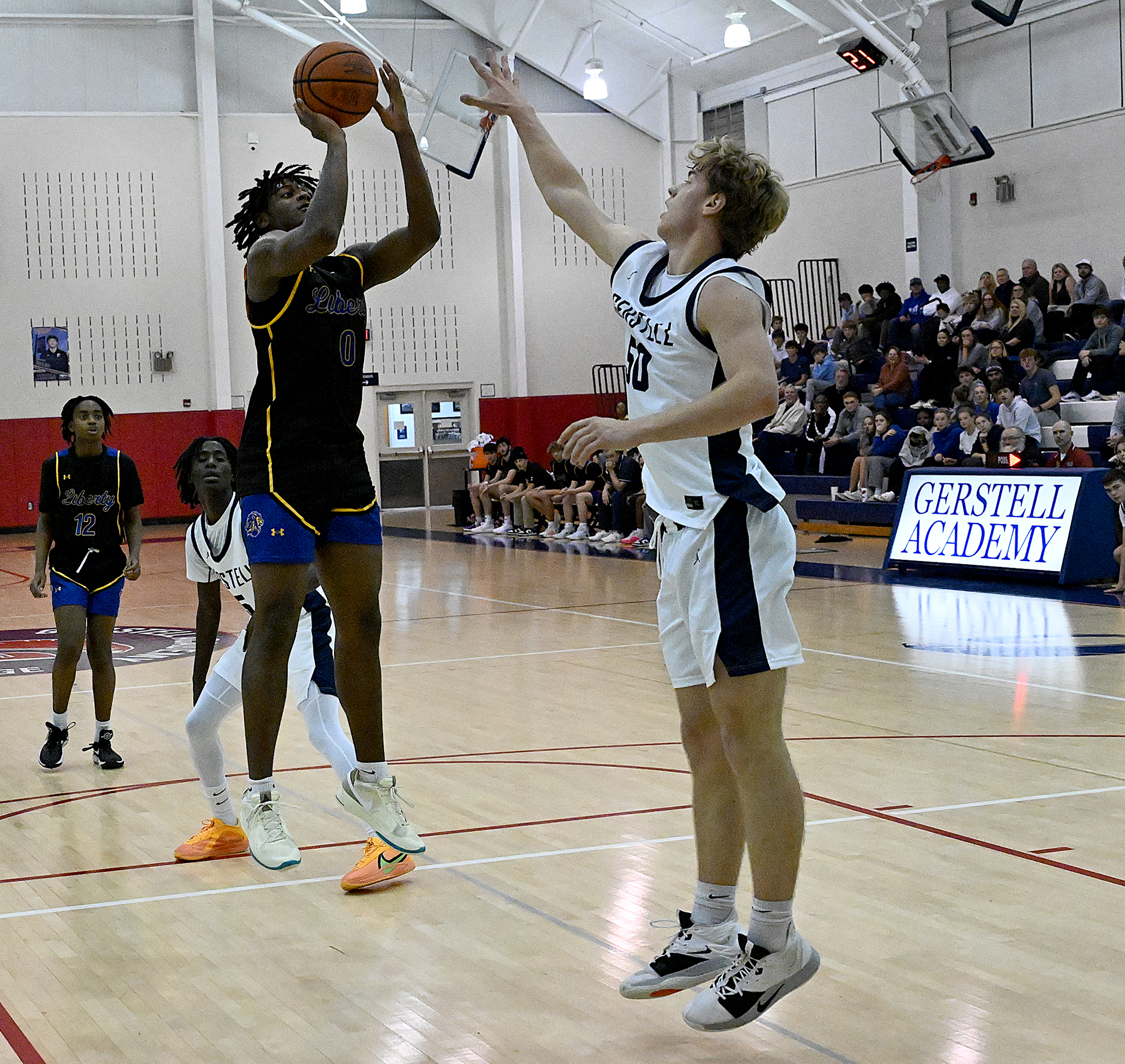 Liberty #0, Trisdan West pull-up jumpshot for two in the...