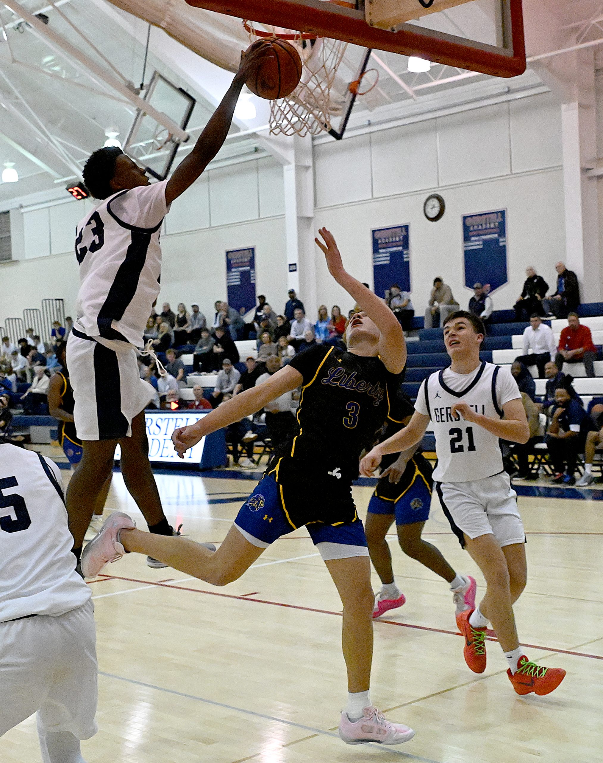 Gerstell #23, Corey Graham blocks a layup shot by Liberty...