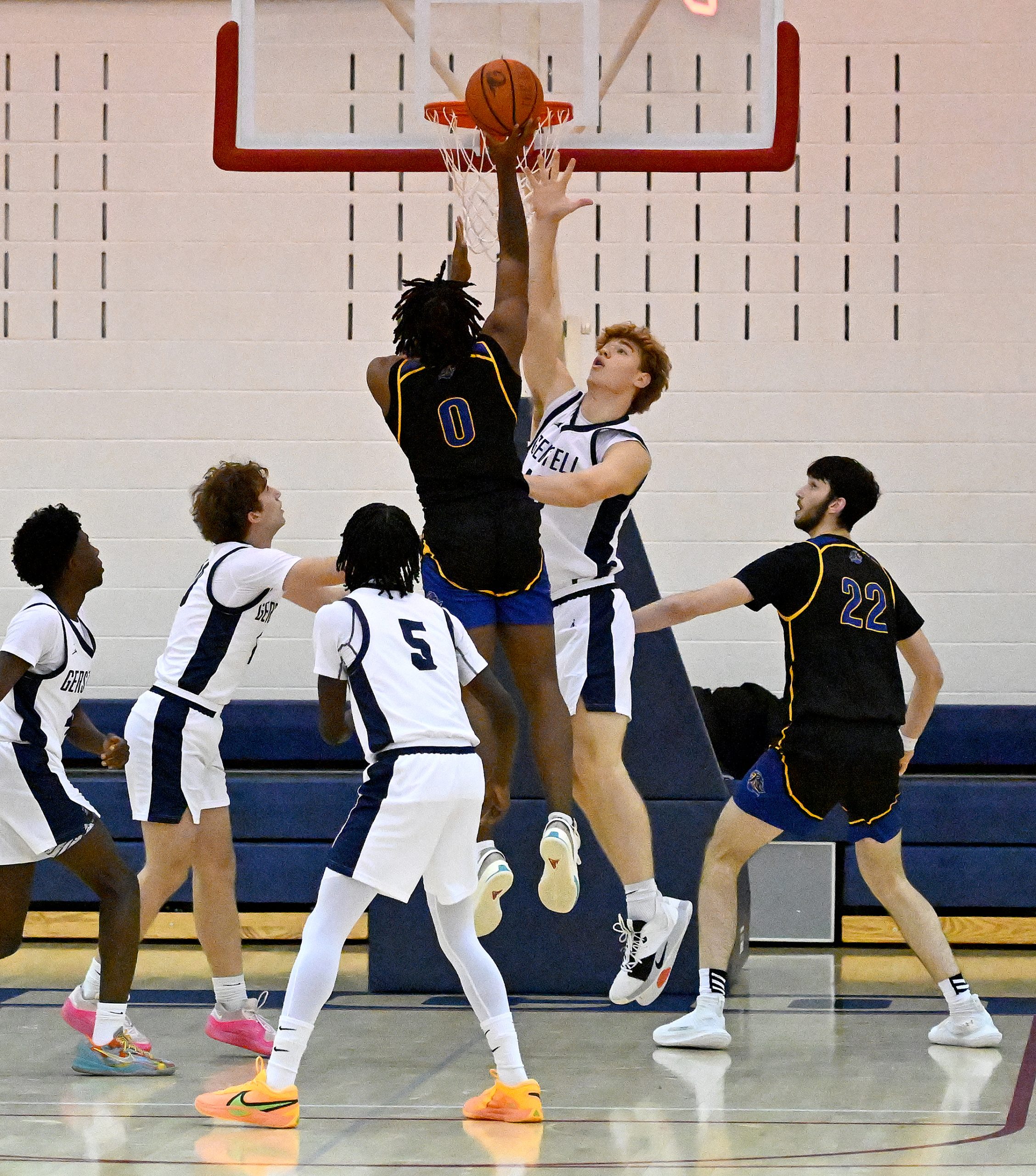 Liverty #0, Trisdan West, shoots over Gerstell #50, Colin Toms...