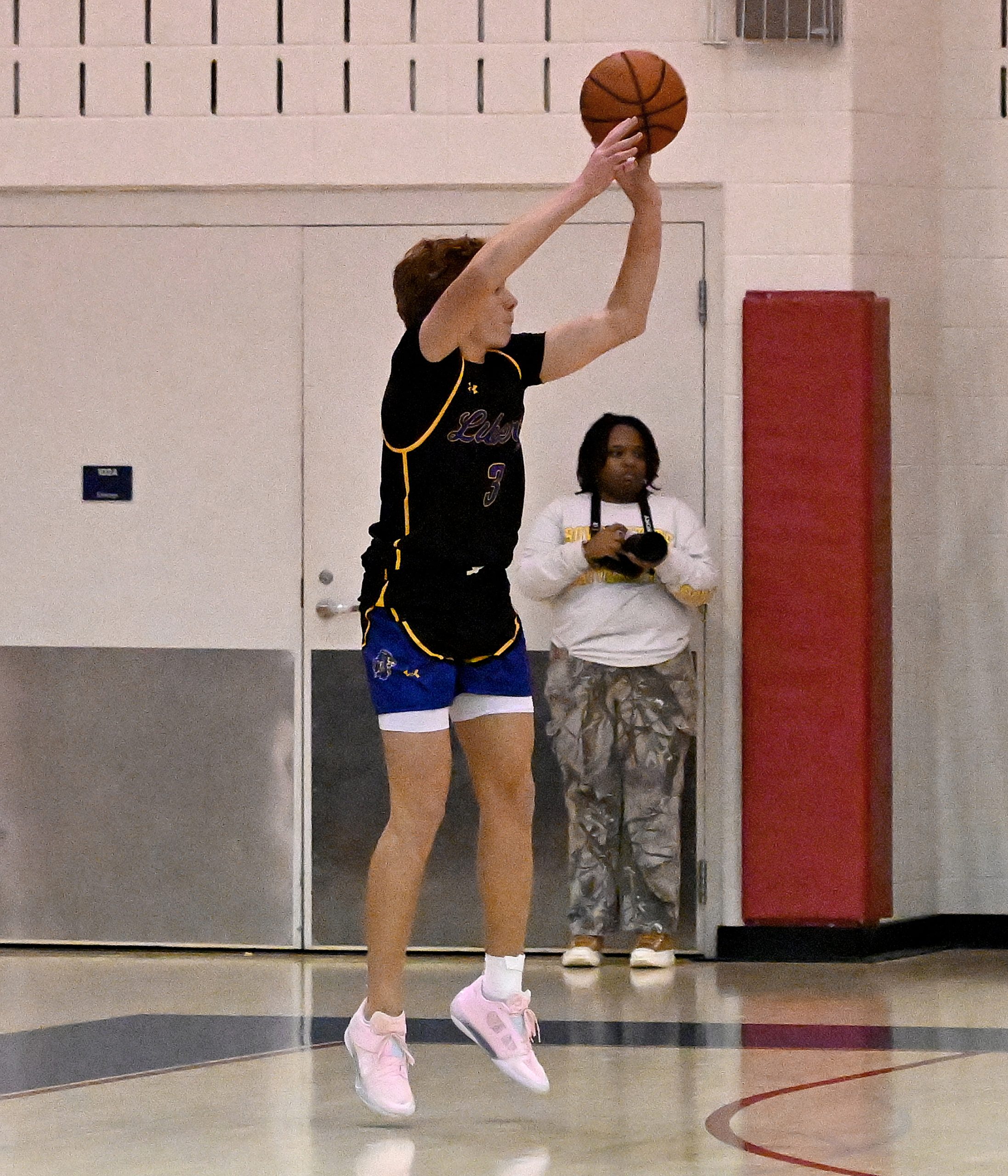 Liberty #3, Jayden Zubrum, sinks a three in the 1st...