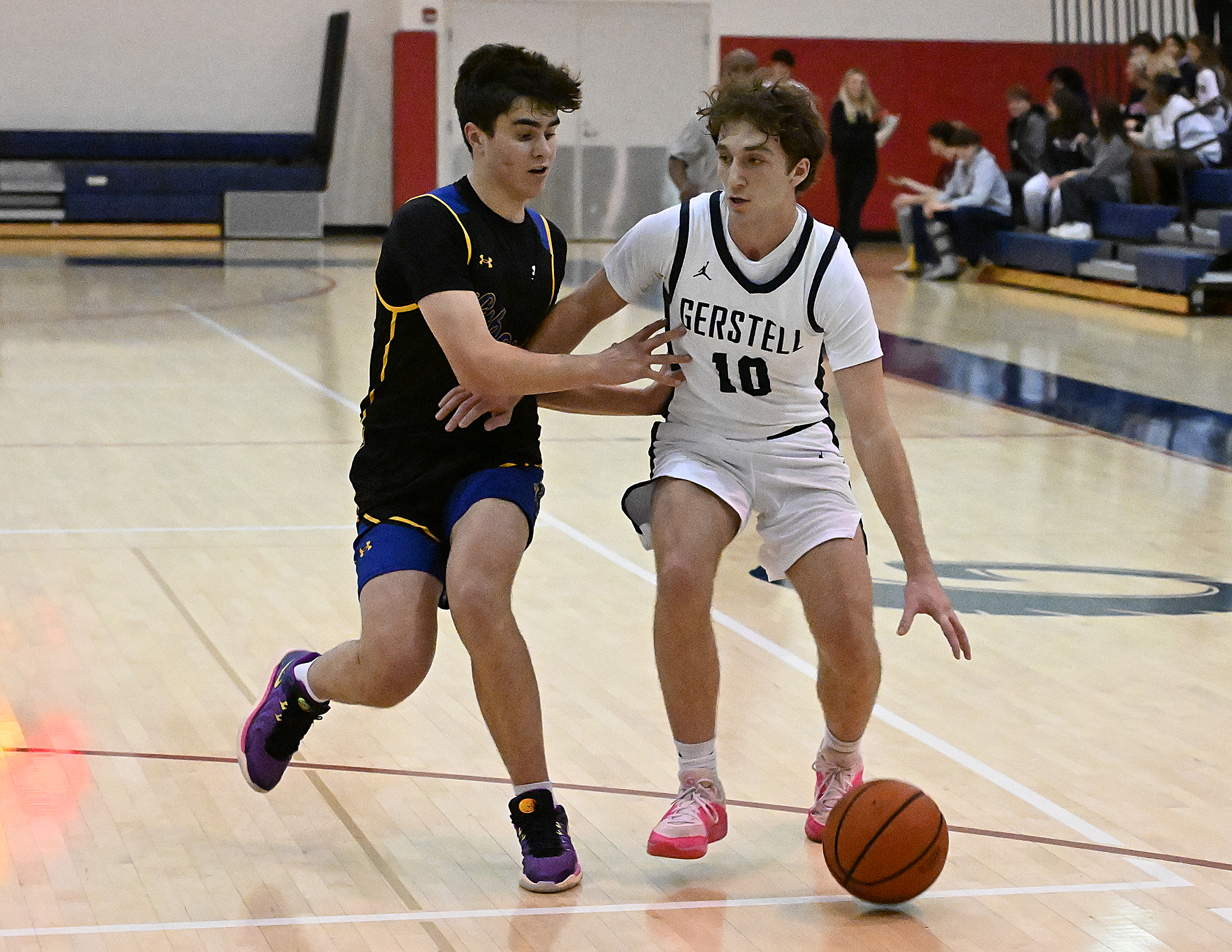 Gerstell's Emre Tari drives toward the basket during Friday's game...