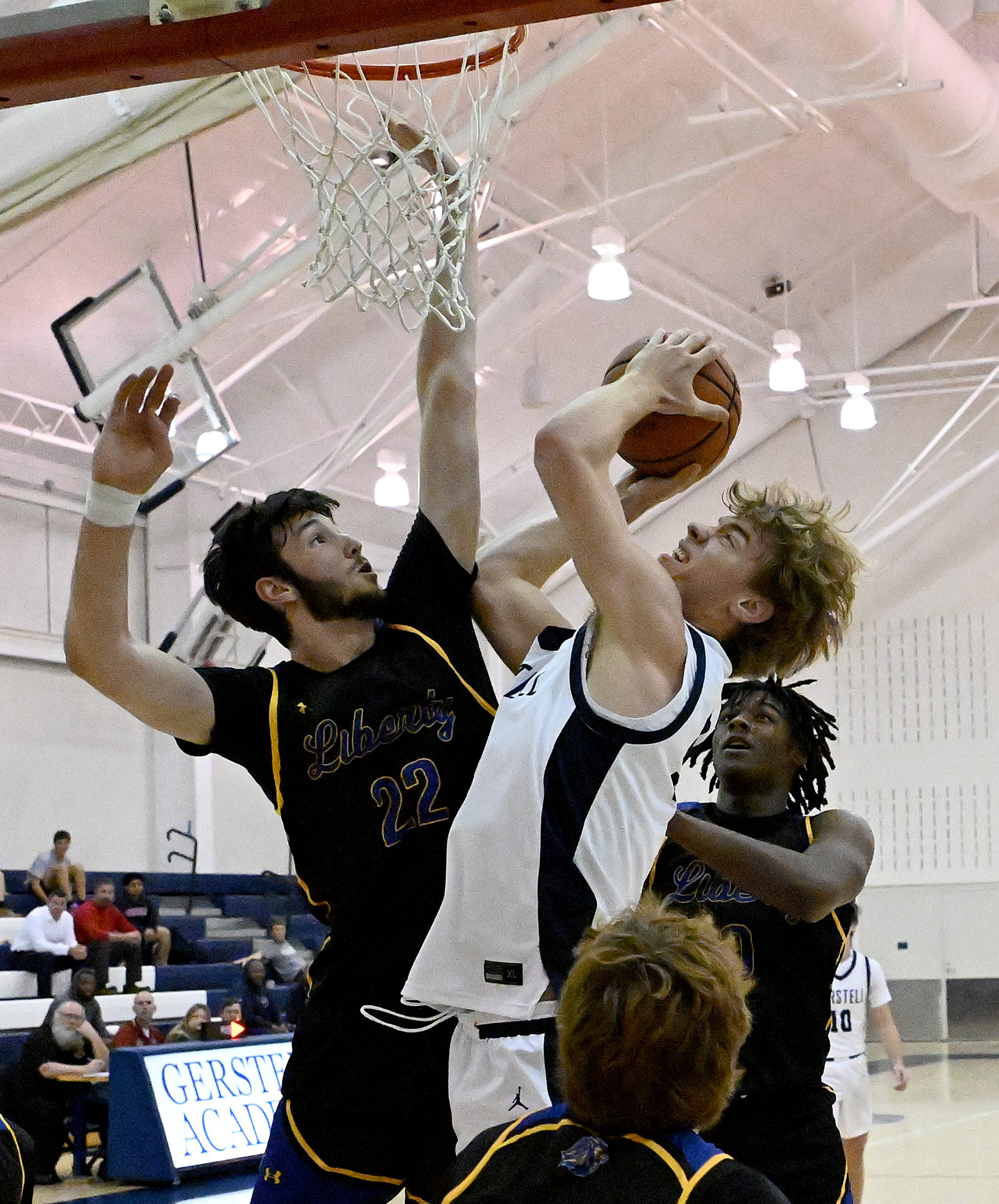 Gerstell #50, Colin Toms put-back after offensive rebound is blocked...