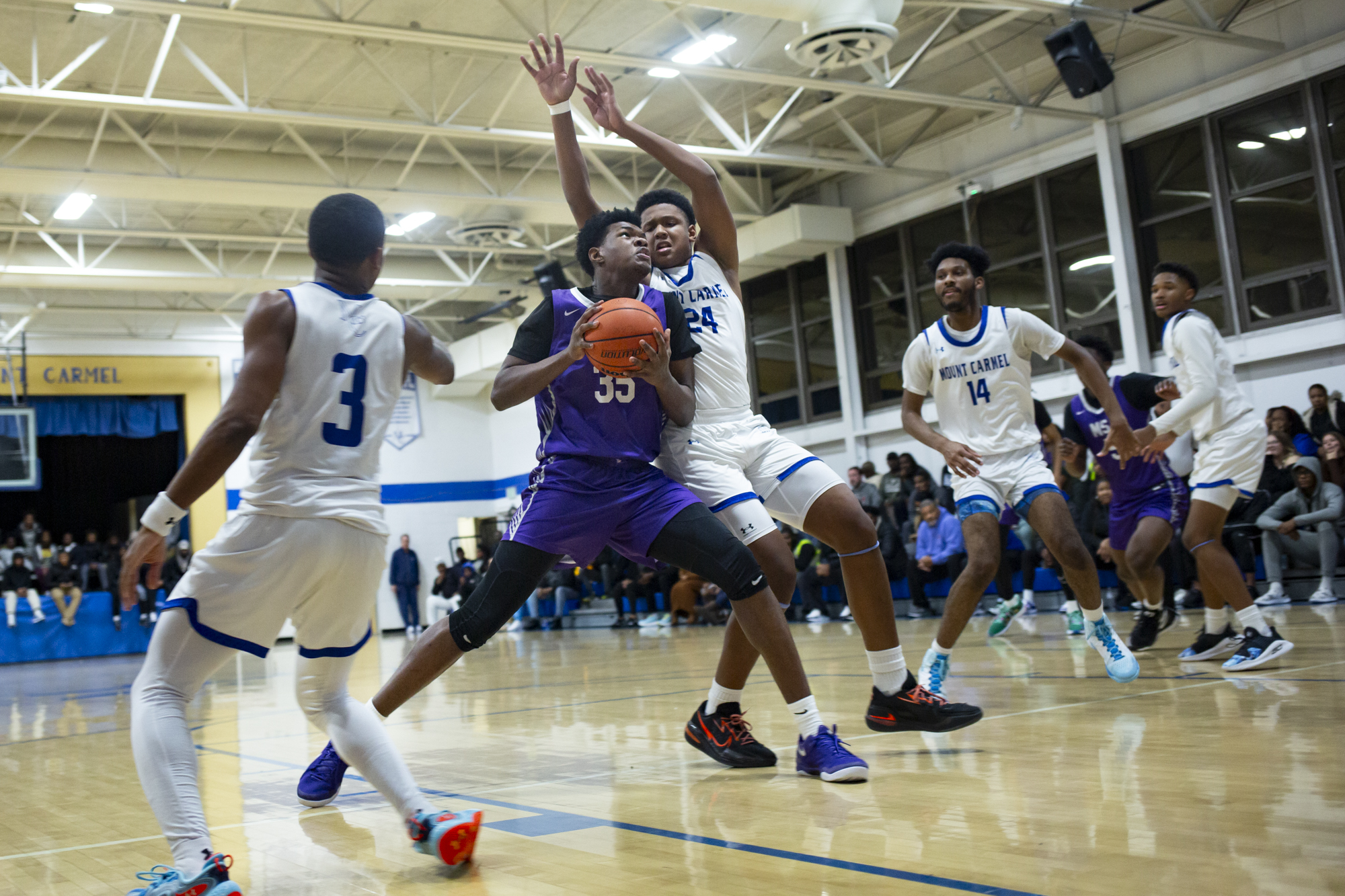 Kenneth Anthony drives through traffic during the game between Our...