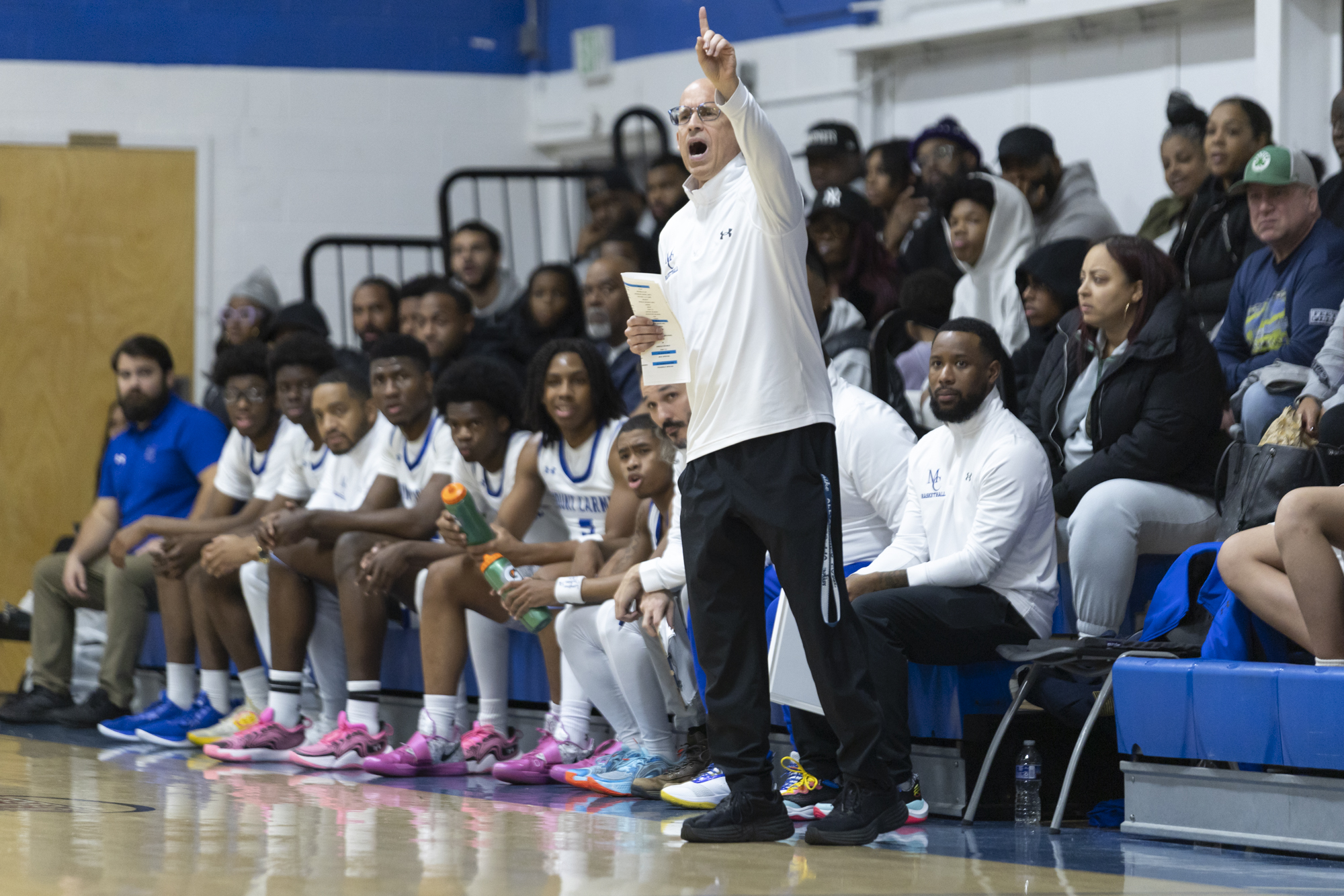 Mount Carmel Head Coach Tony Martin calls a play during...