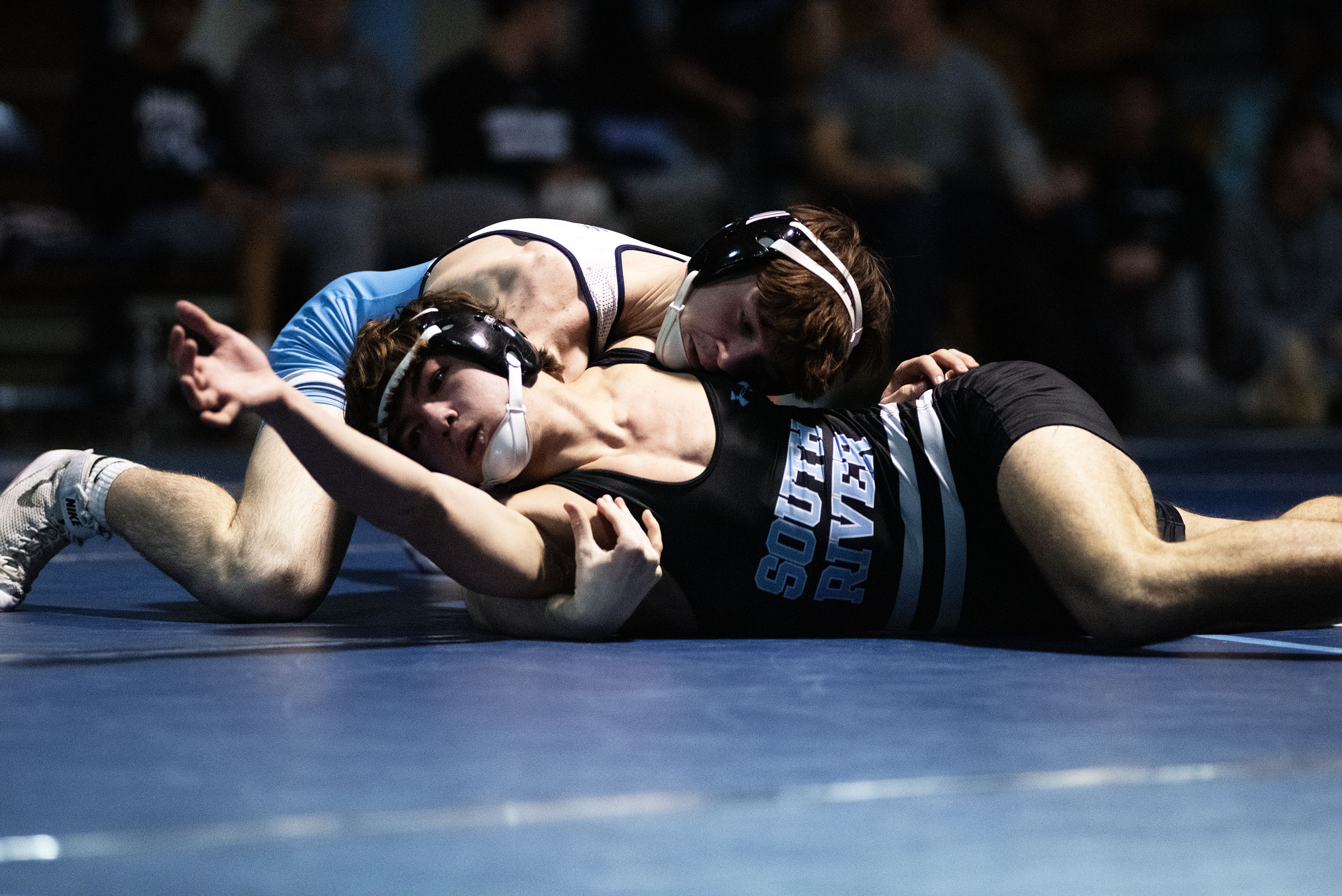 Chesapeake's Rex Graves, top, and South River's Ethan Berger compete...
