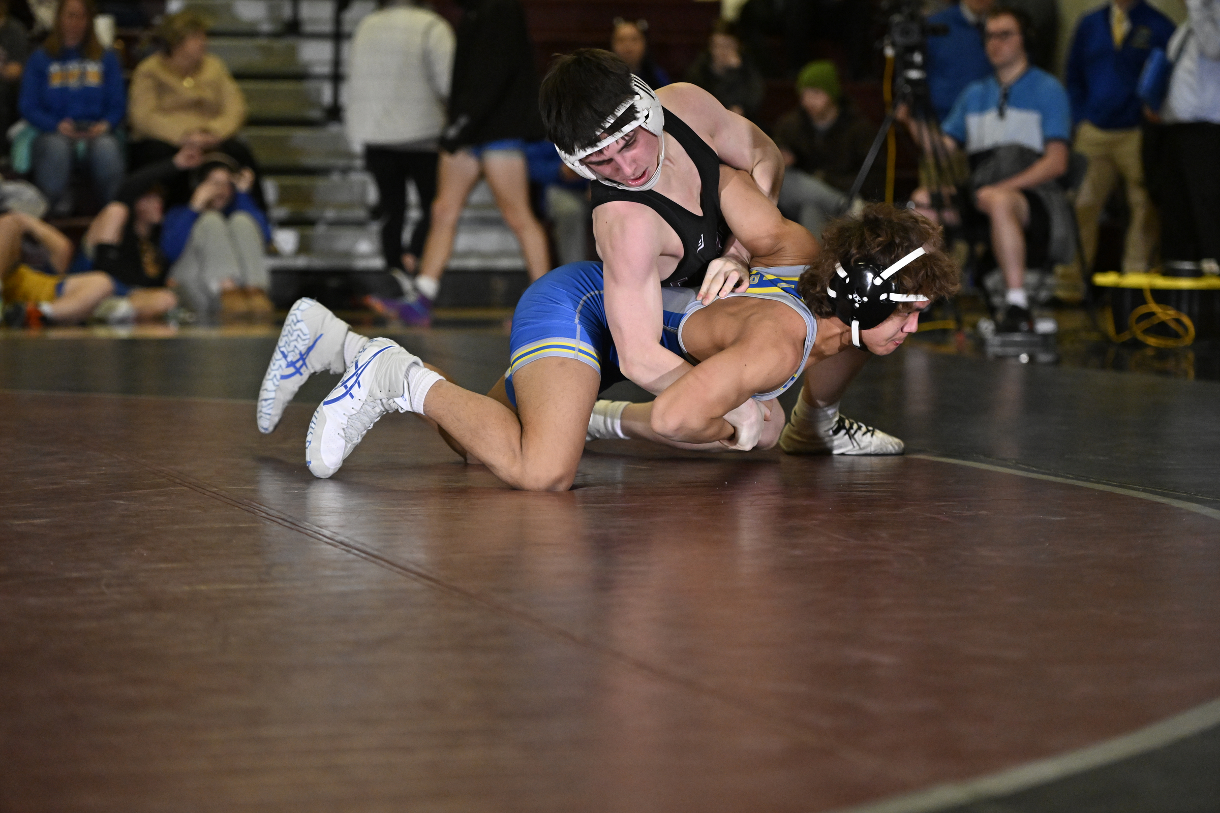 Winters Mill's Willis Kiler looks to turn Liberty's Franklin Schaffer...