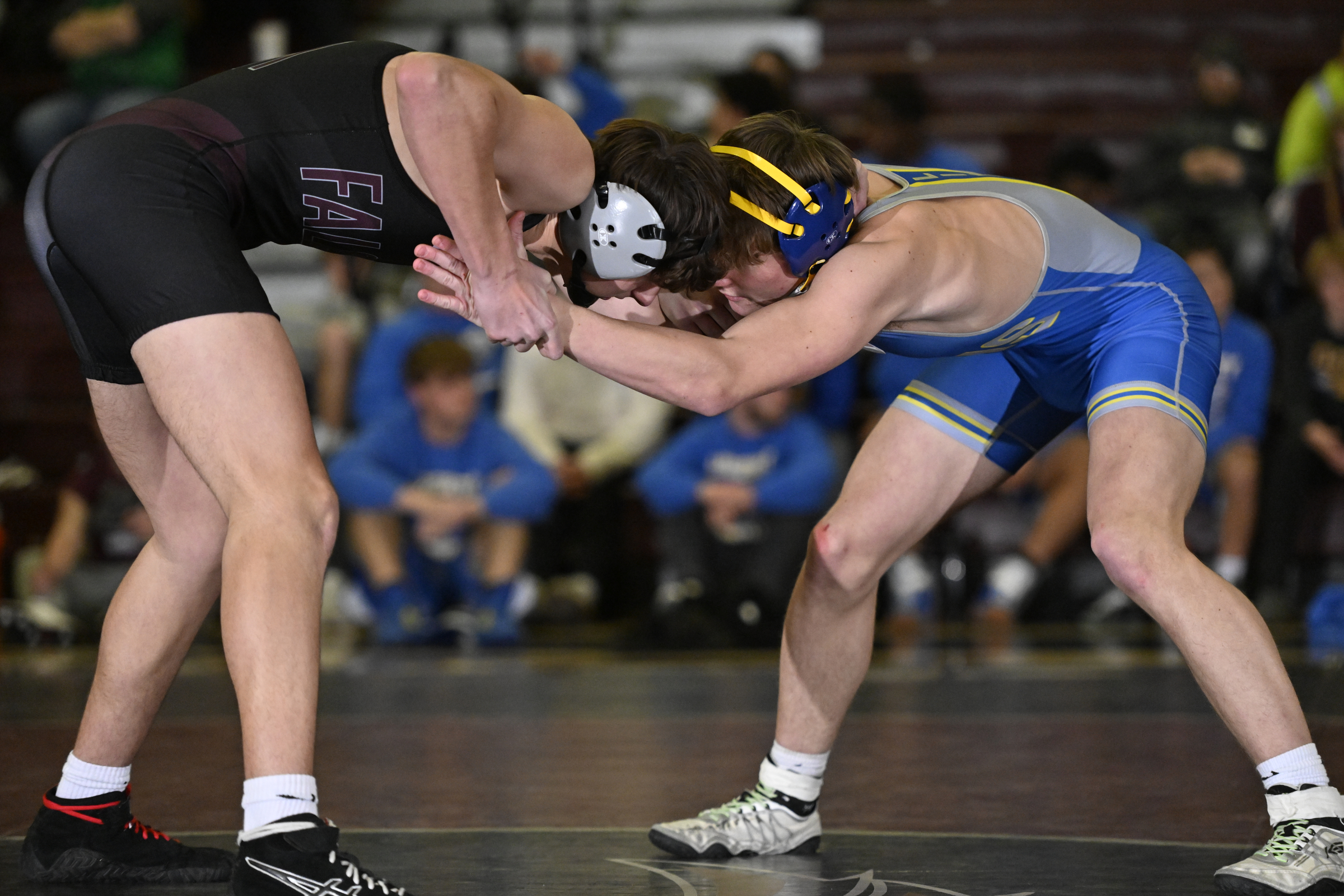 Winters Mill's Landon Buchman grapples with Liberty's Parker Reynolds during...