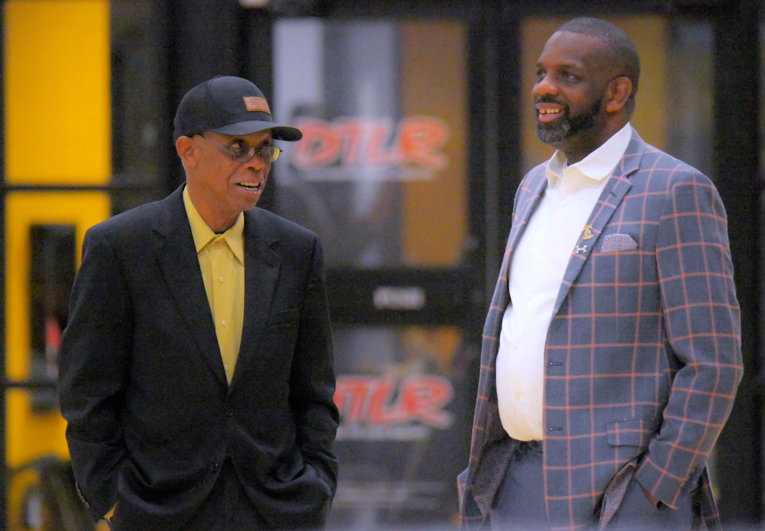 St. Frances Academy Panthers assistant coach Kenneth Taylor, left and...