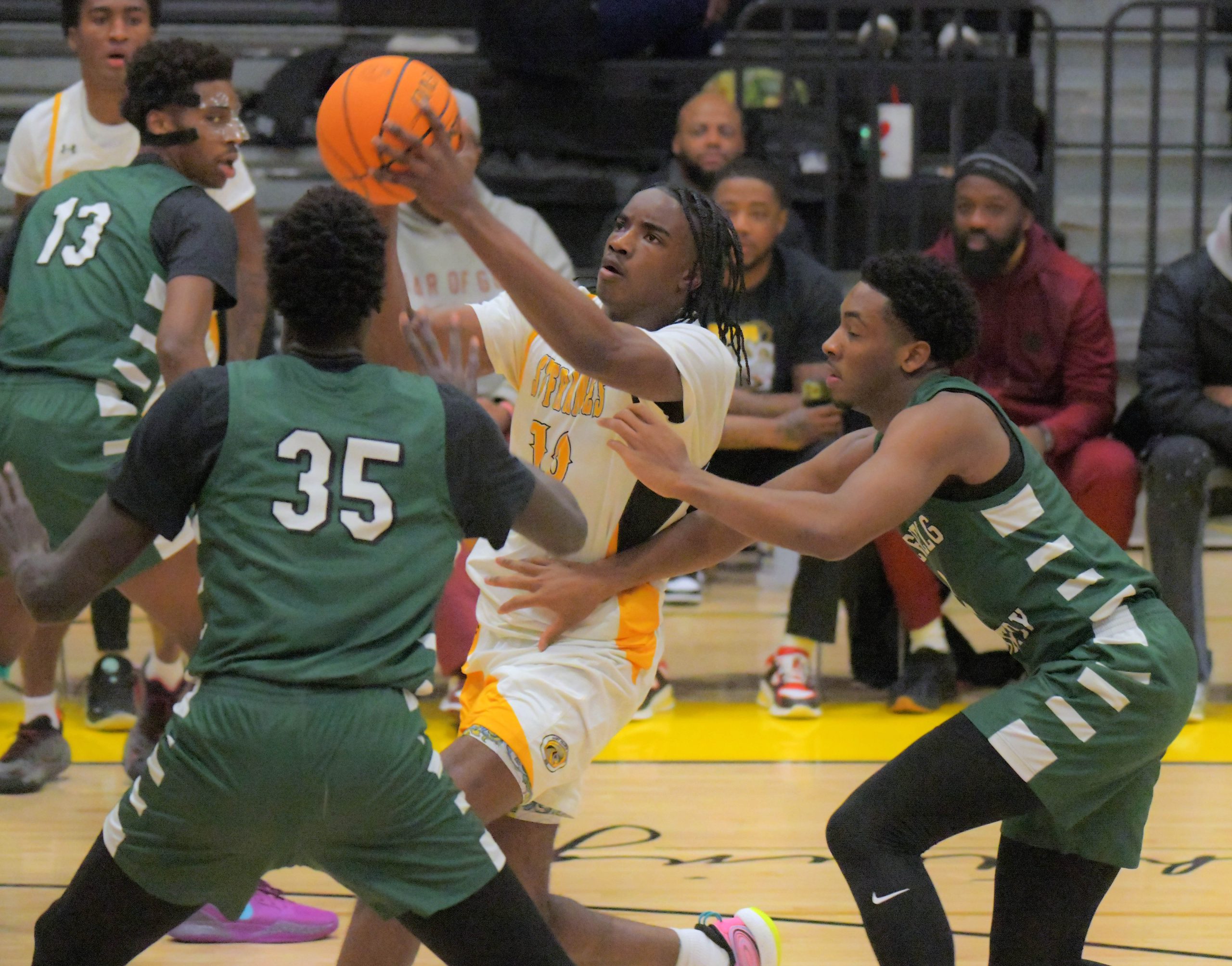 St. Frances wing Trent Egbiremolen powers between Glenelg Country forwards...
