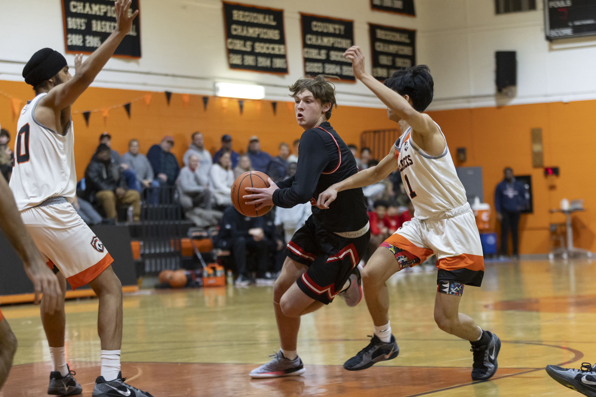 Chase Huber drives the paint as Eastern Technical High School...