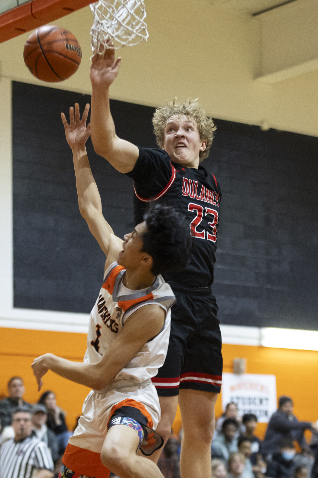 Eastern Tech’s Adrian Pefianco maneuvers in the air to avoid...