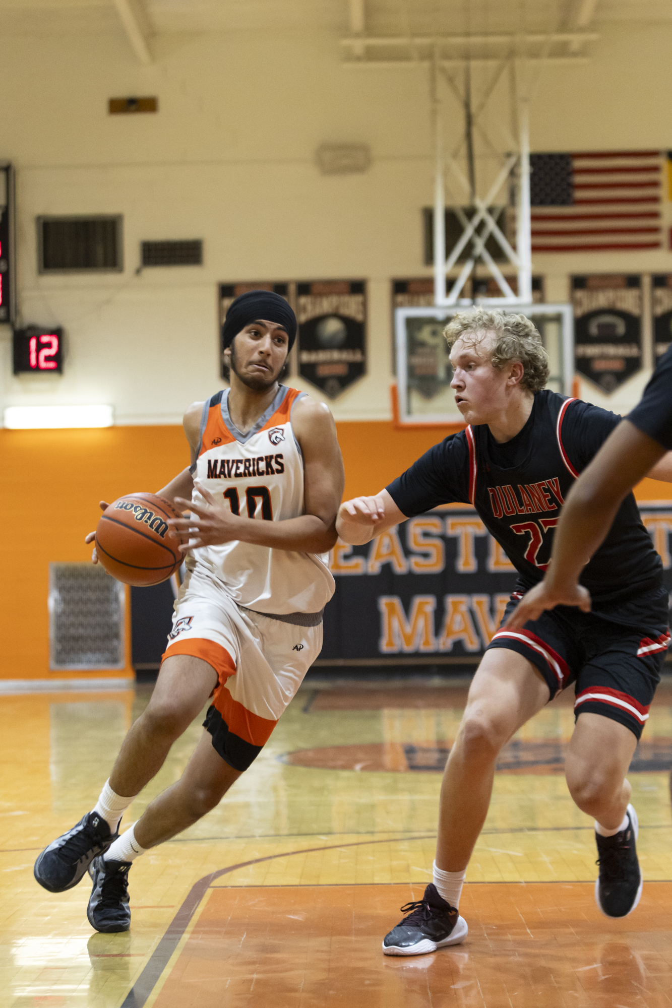 Prabhnoor Singh drives into the paint as Eastern Technical High...