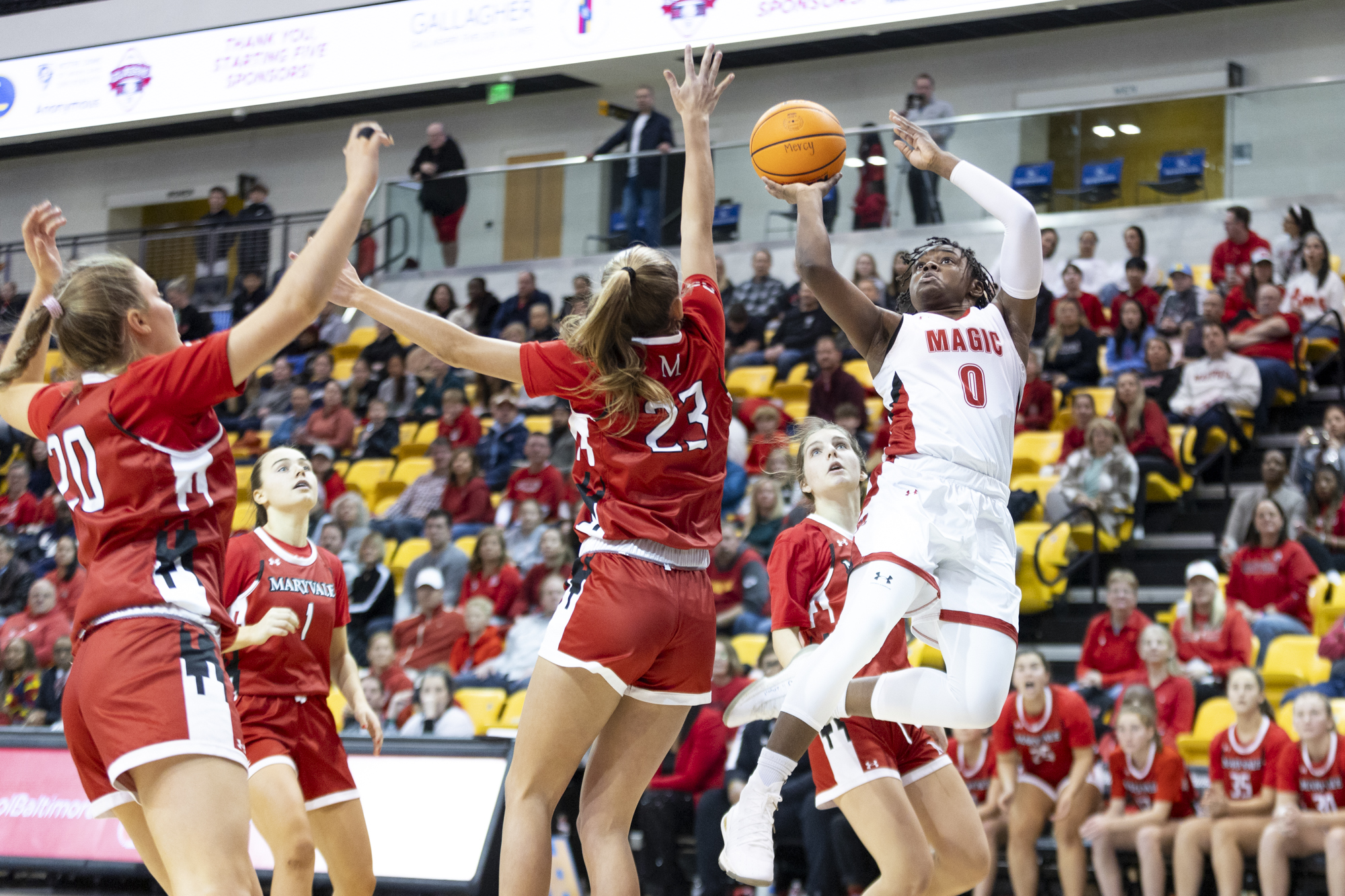 Milan Brown fires off a fade away shot during The...