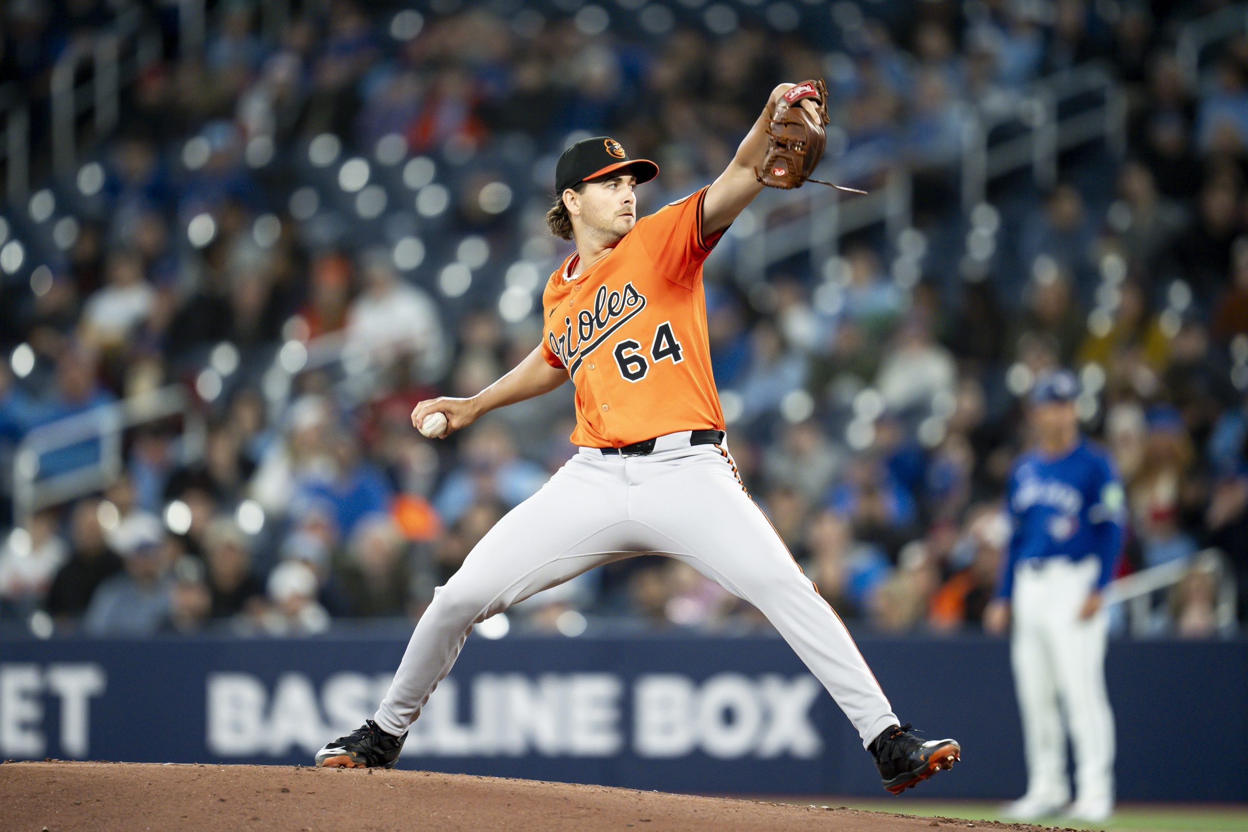 Baltimore Orioles pitcher Dean Kremer (64) throws during the first...
