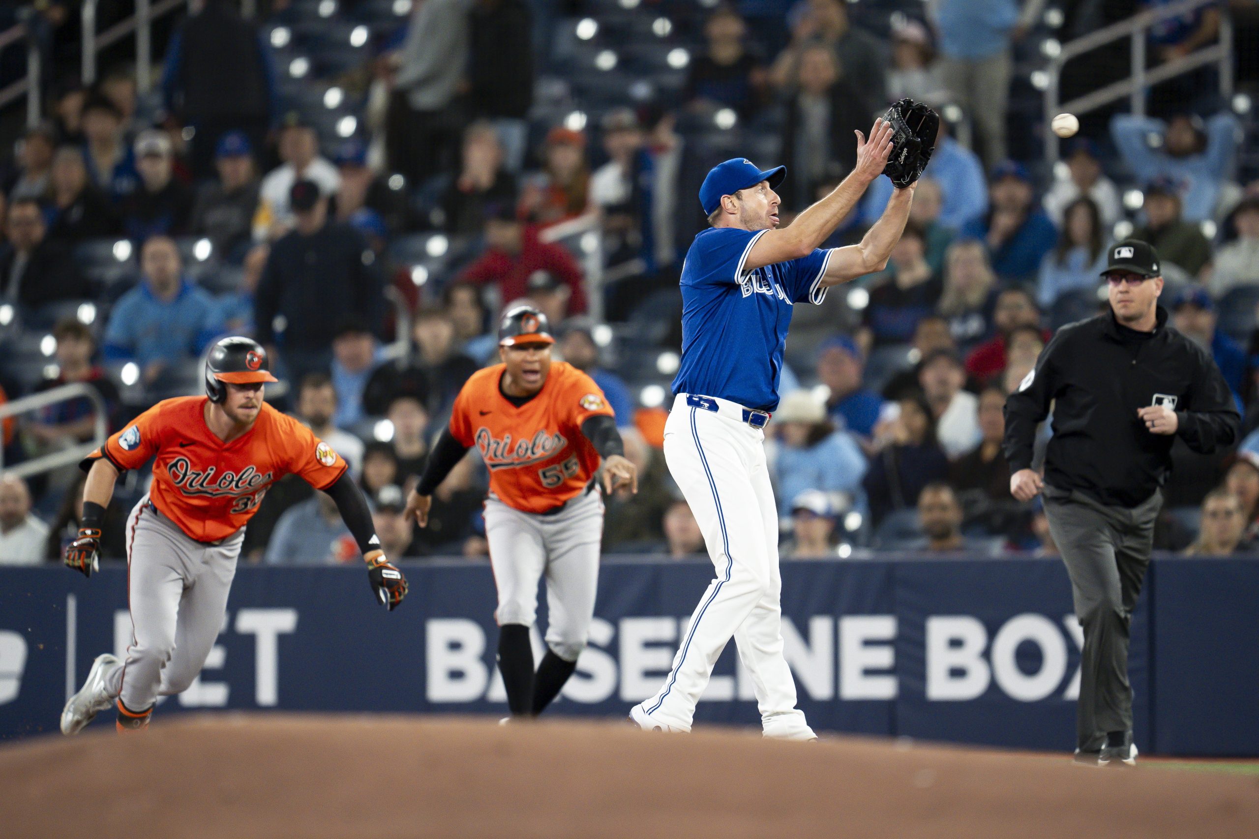 Toronto Blue Jays pitcher Max Scherzer, third from left, prepares...