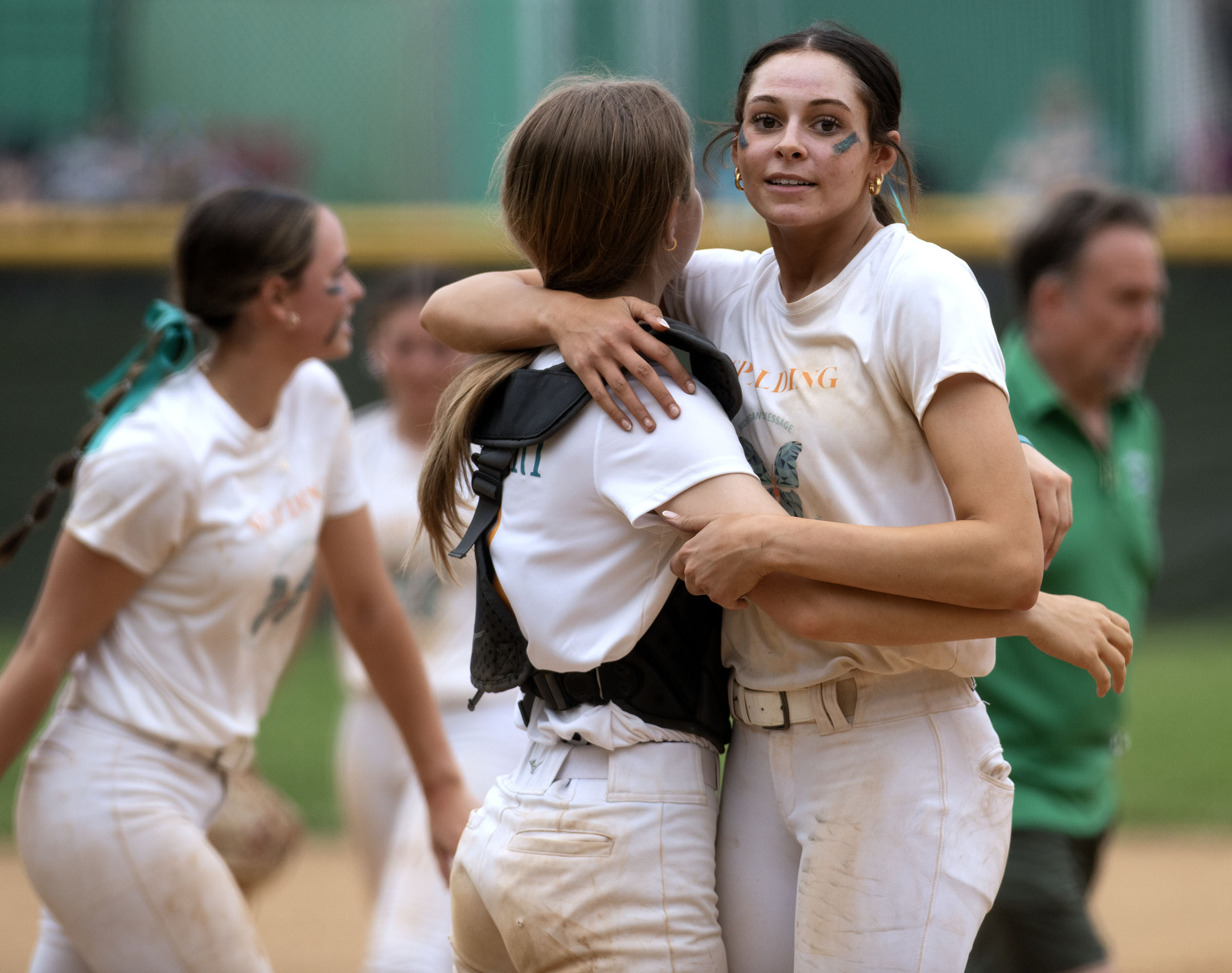 Spalding pitcher Cessi Prince, right, and catcher Zoey Bronzert celebrate...