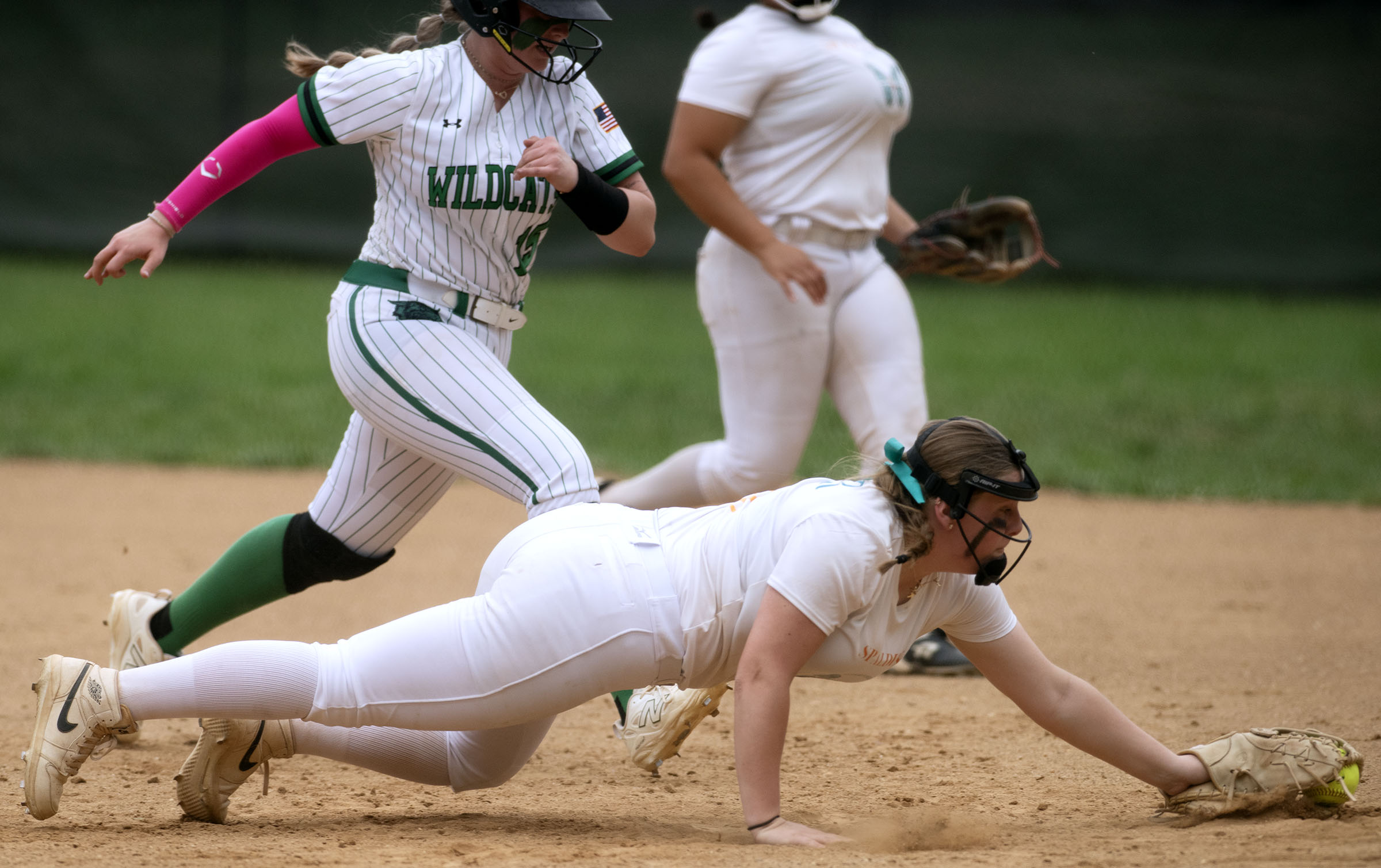 April 19, 2025- Spalding first baseman Cayleigh Spear dives to...