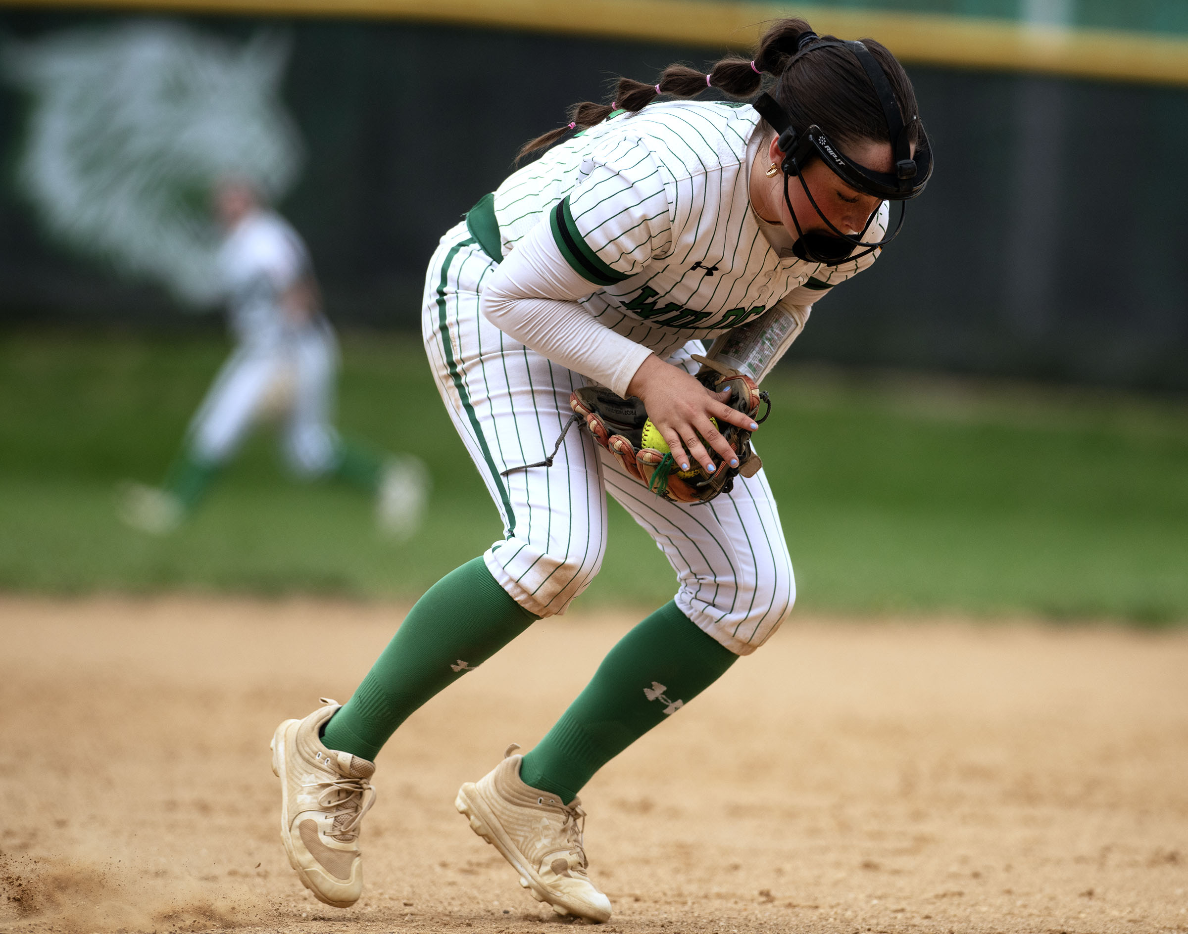 April 19, 2025- Arundel third baseman Emily Felski fields a...