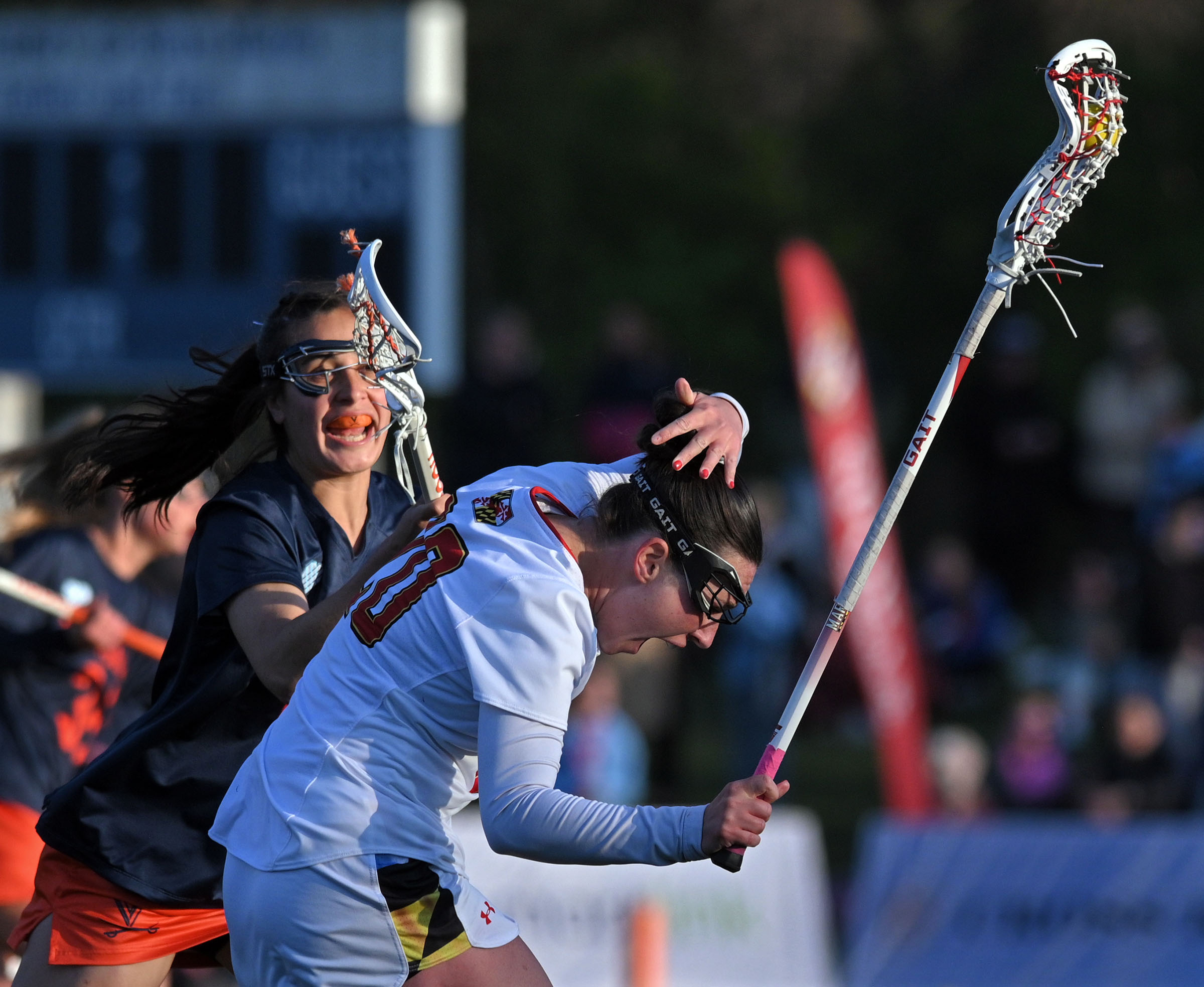 Maryland’s Neve O'Ferrall, center, reacts to the defensive effort by...