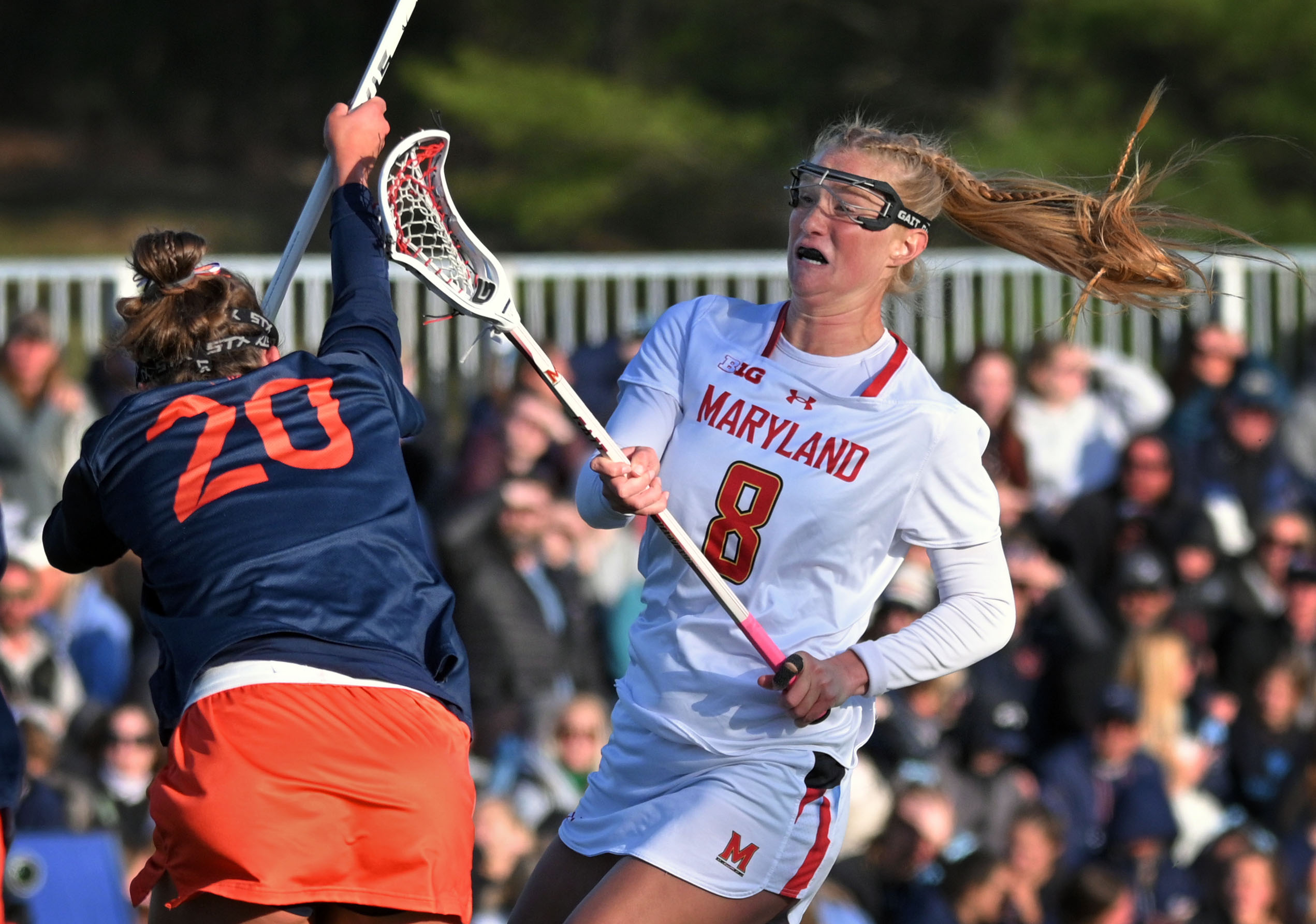 Maryland’s Lauren Lapointe, right, follows through after scoring in front...