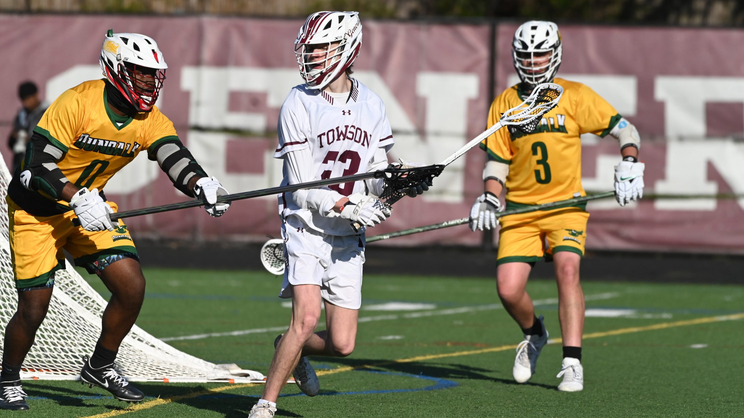 Towson's Finley Hines controls the ball as Dundalk's Jocquan Jenkins,...
