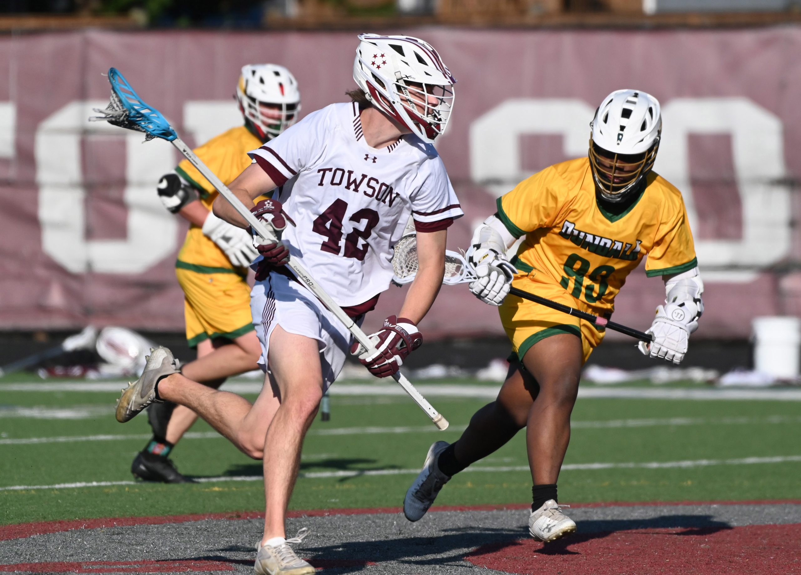 Towson's Jack Nowlan moves with the ball as Dundalk's Jered...