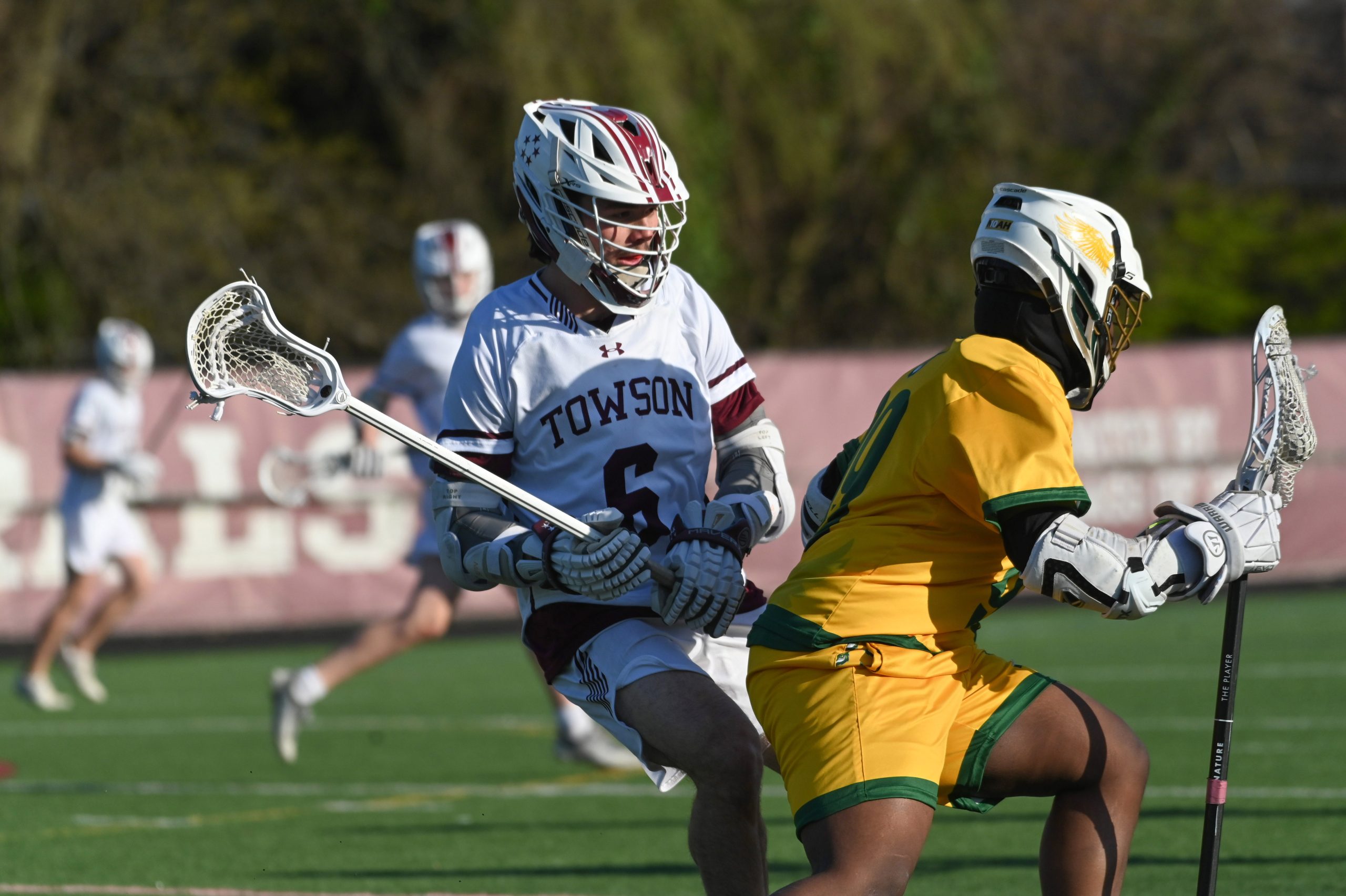 Towson's Alex Tyler defends against Dundalk's Jered Reine during a...