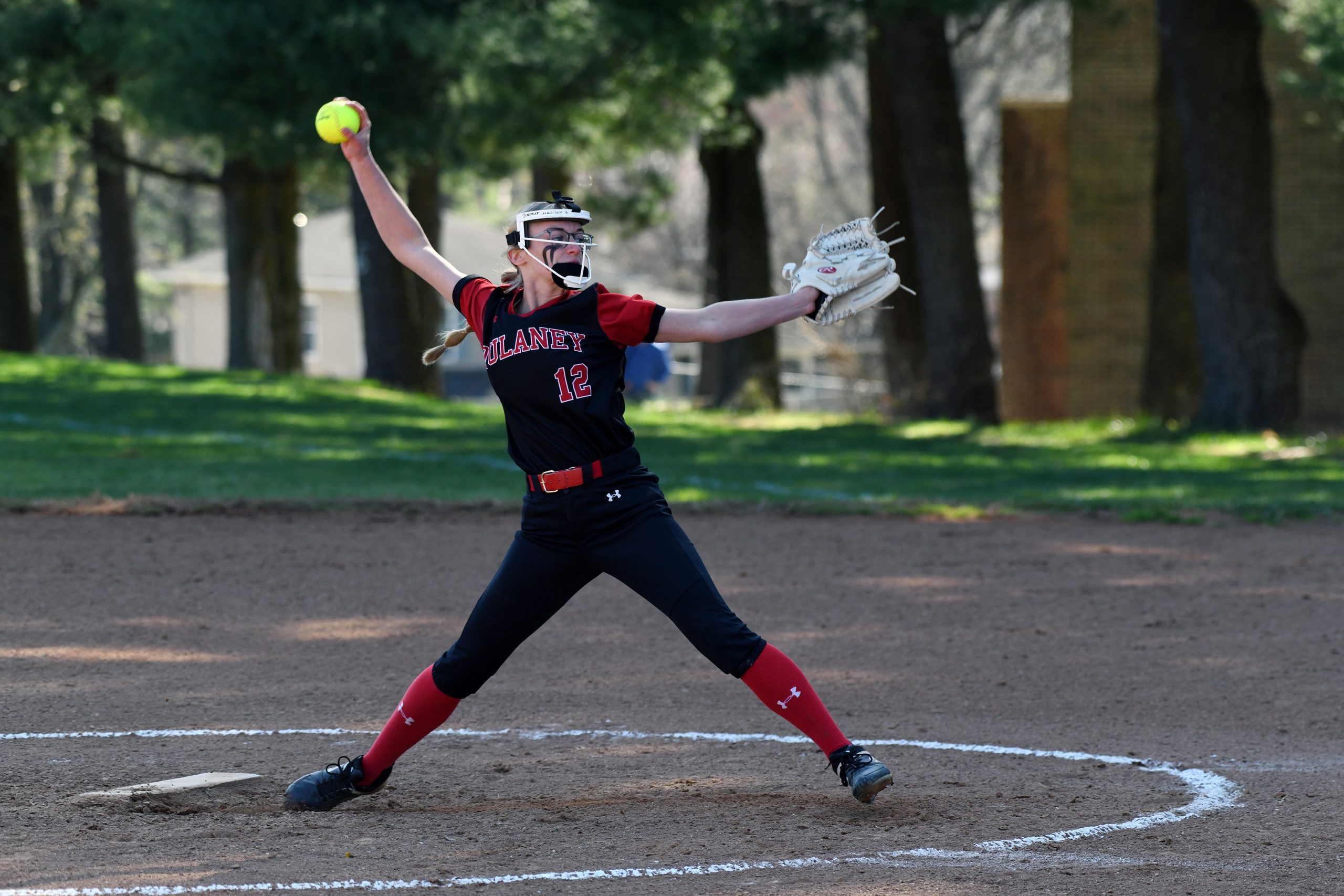 Madison Scruple, Dulaney, pitches against Towson in a softball game...