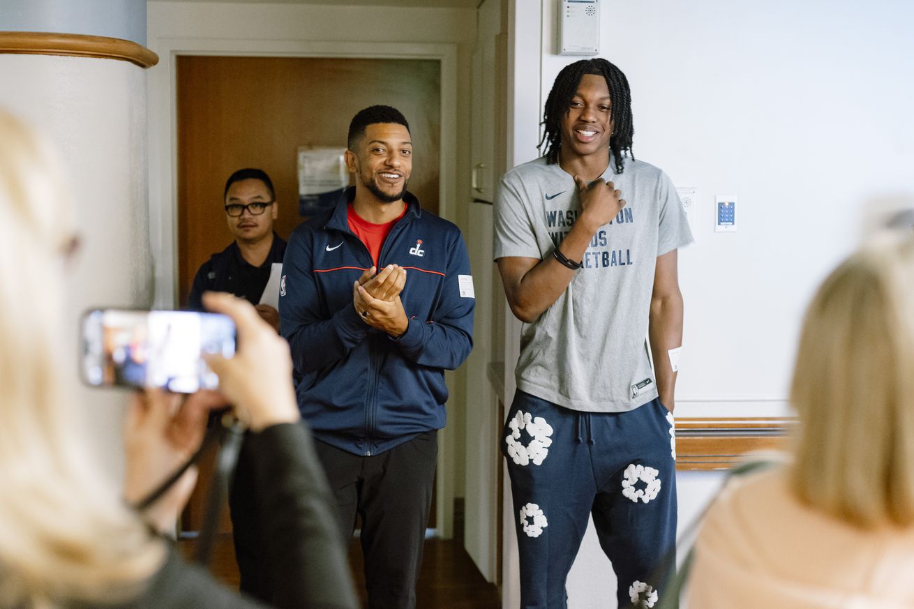 Washington Wizards General Manager Will Dawkins, left, and rook