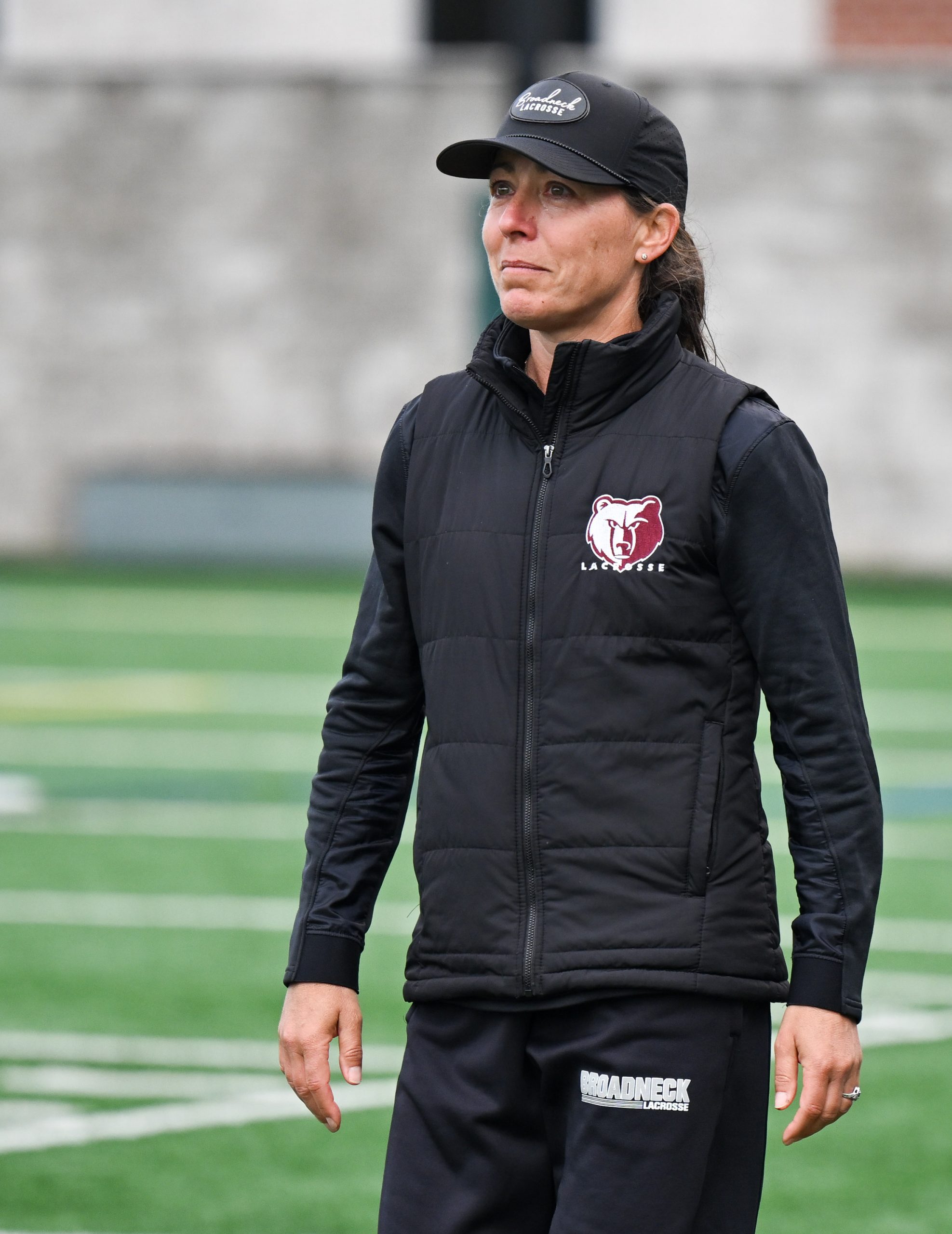 Broadneck head coach Katy Kelley watches her team celebrate their 8-6 win against Urbana in the girls lacrosse 4A state final. (Steve Ruark/Freelance)