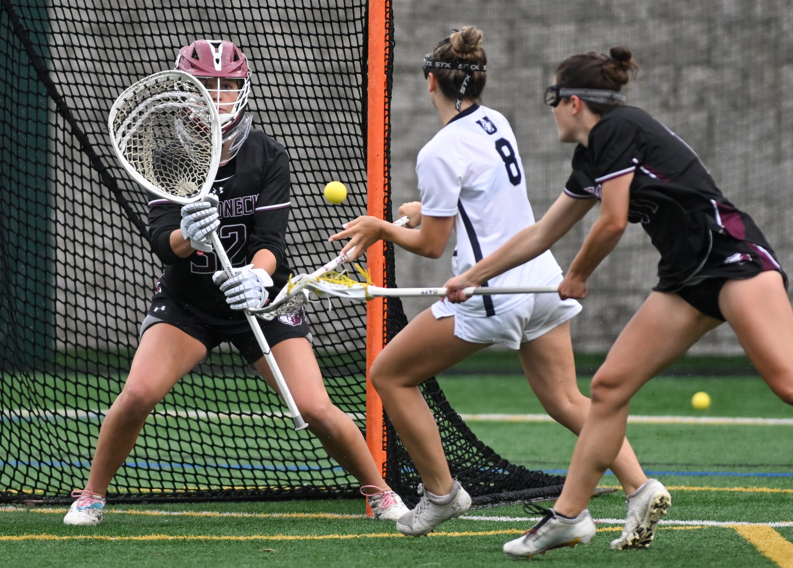 Broadneck defender Nora Lopes, right, stops a shot from Urbana’s...