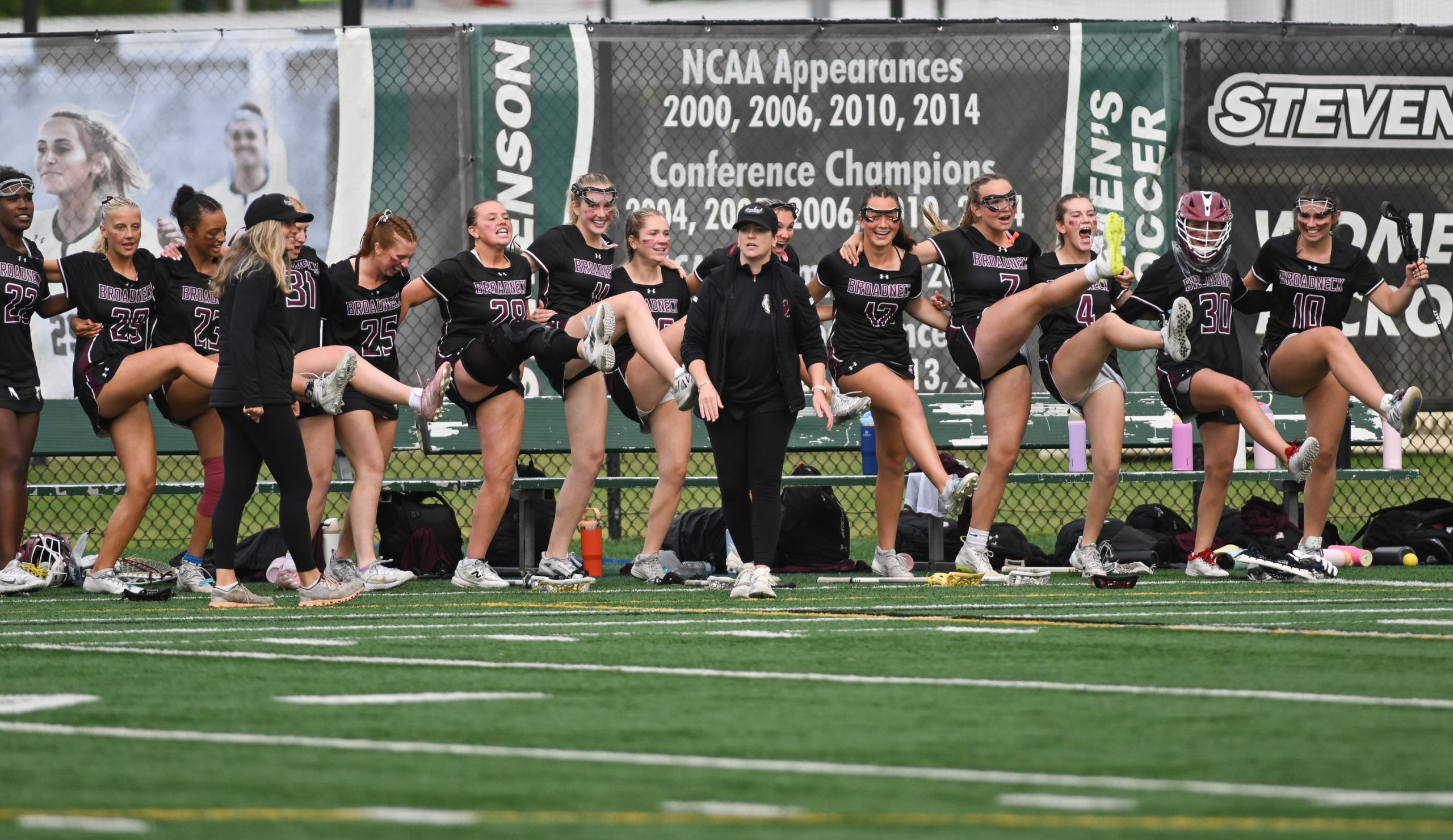 The Broadneck bench celebrates a goal against Urbana. Coach Katy...