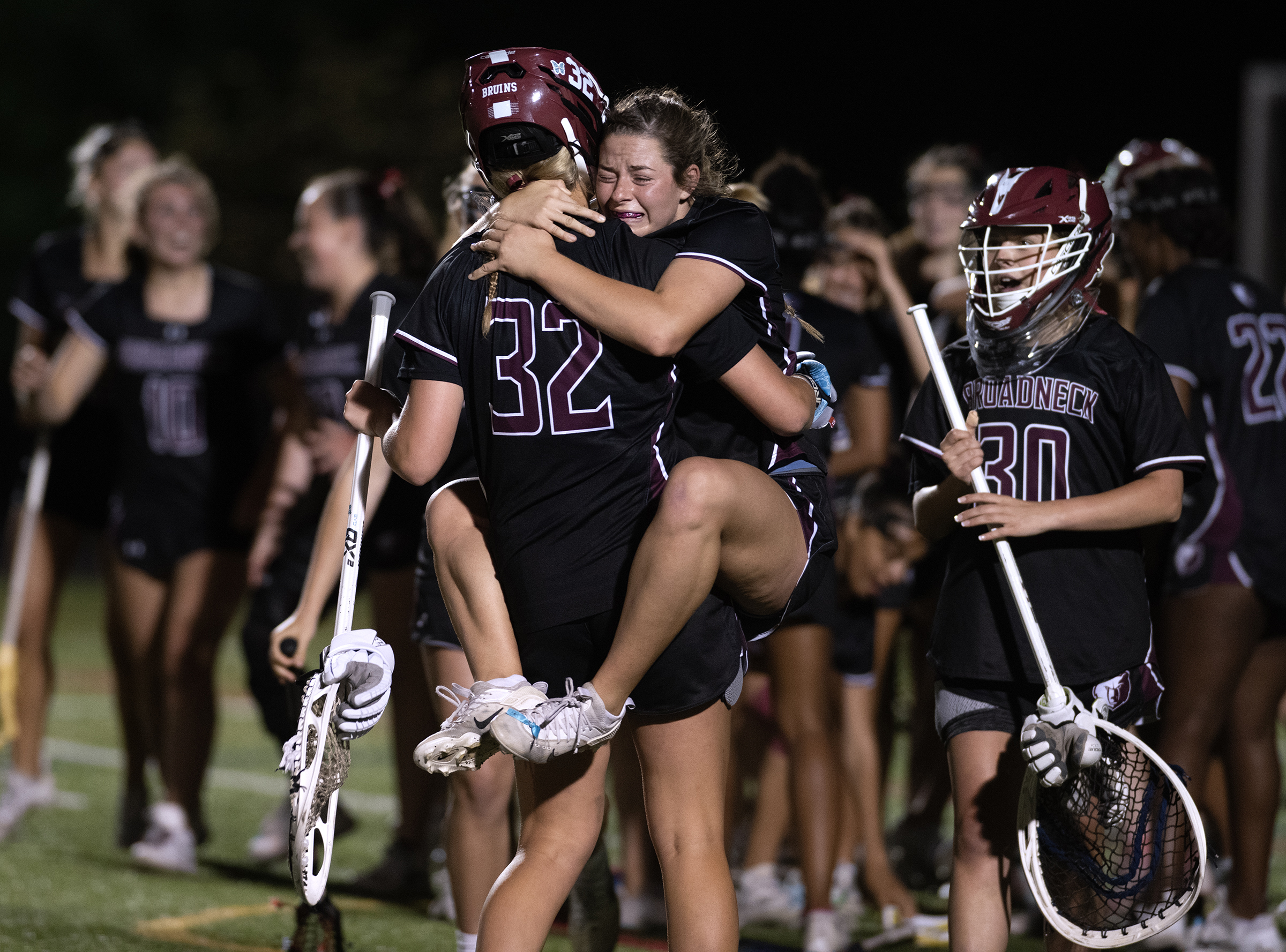 May 5, 2025- Broadneck’s Naomi Doyle hugs goalie Molly Robison...