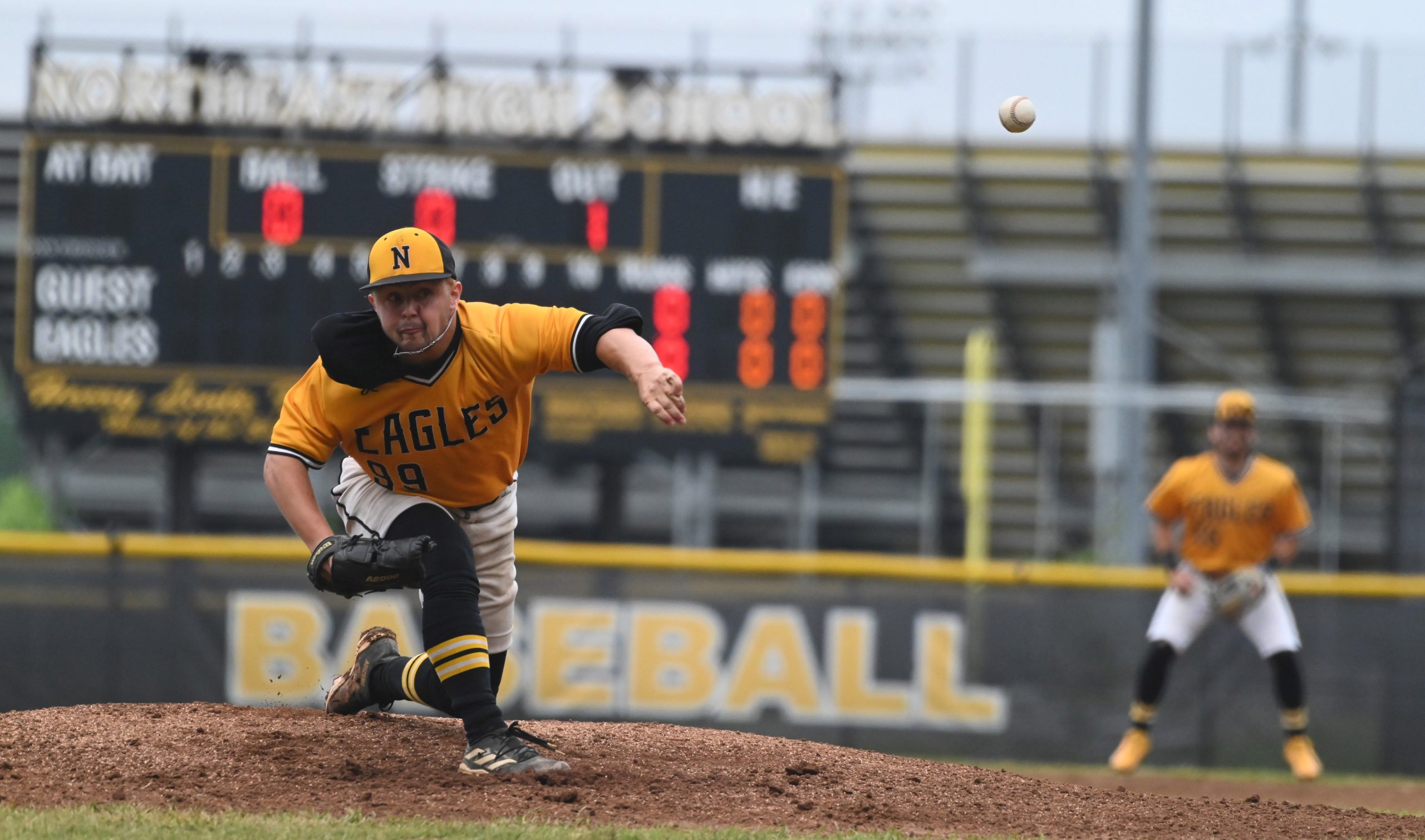 Northeast’s Jayden Saraullo delivers a pitch to a Chesapeake batter...