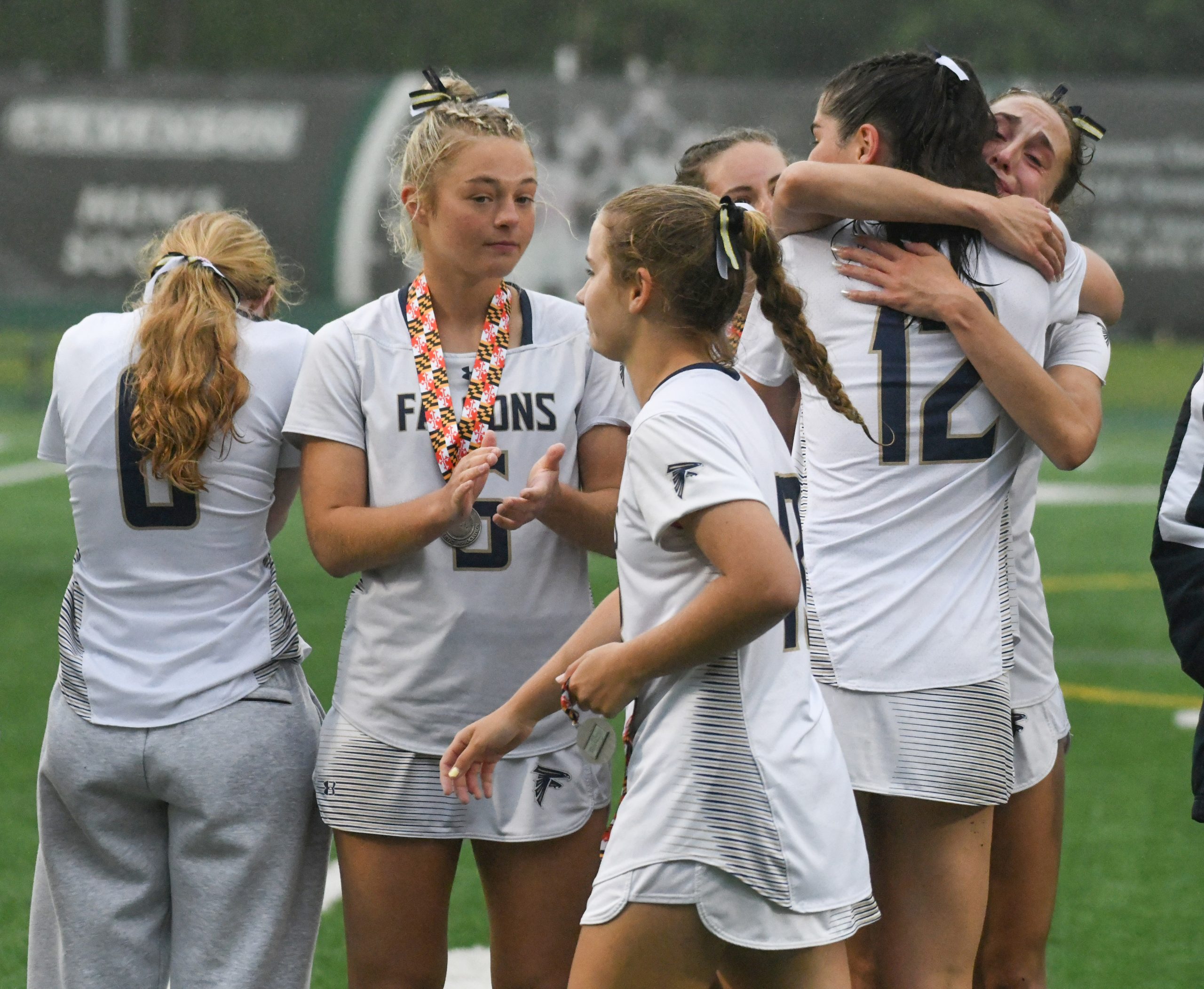 Severna Park players console each other after their loss to...