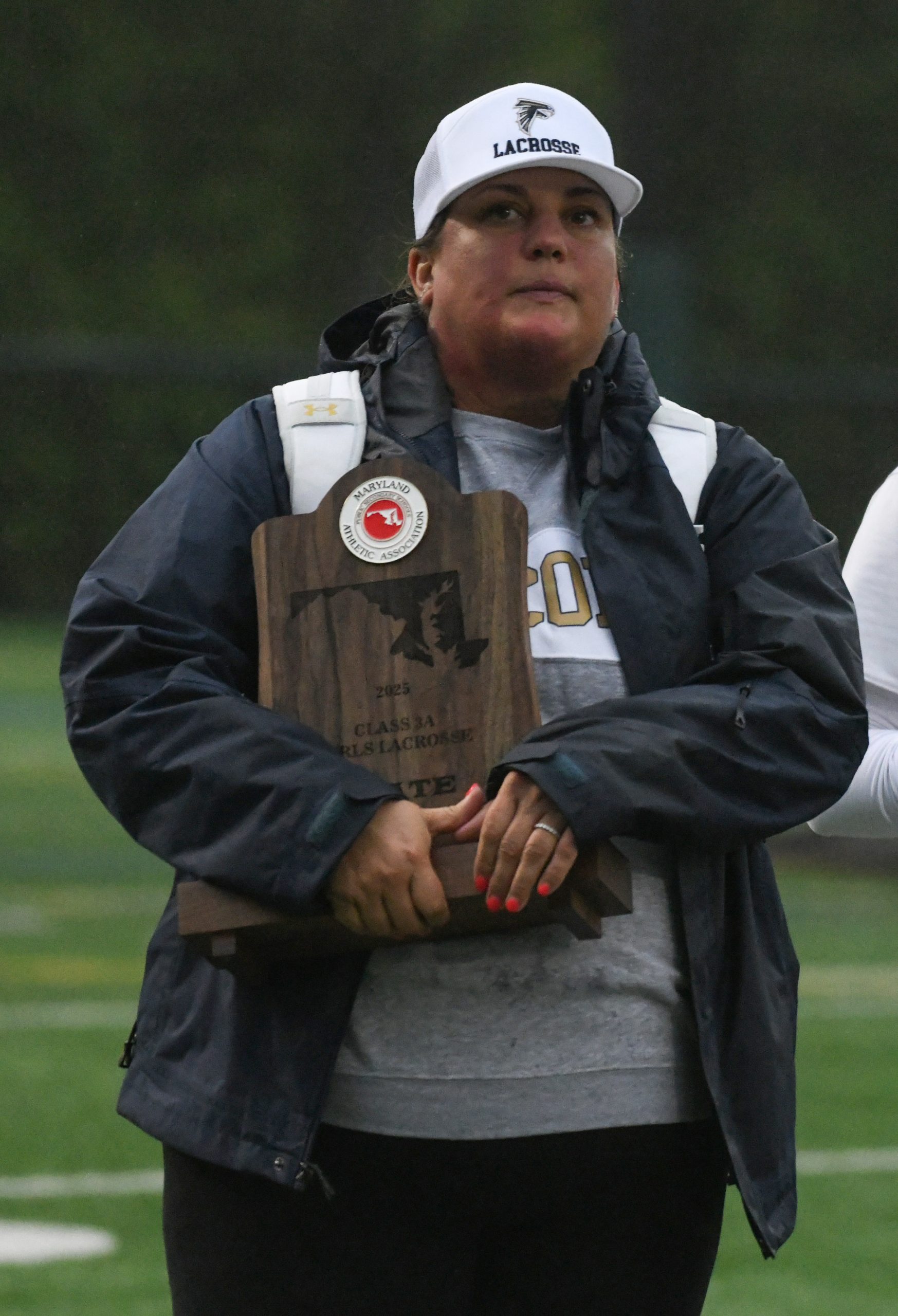 Severna Park head coach Annie Houghton with the finalist trophy...