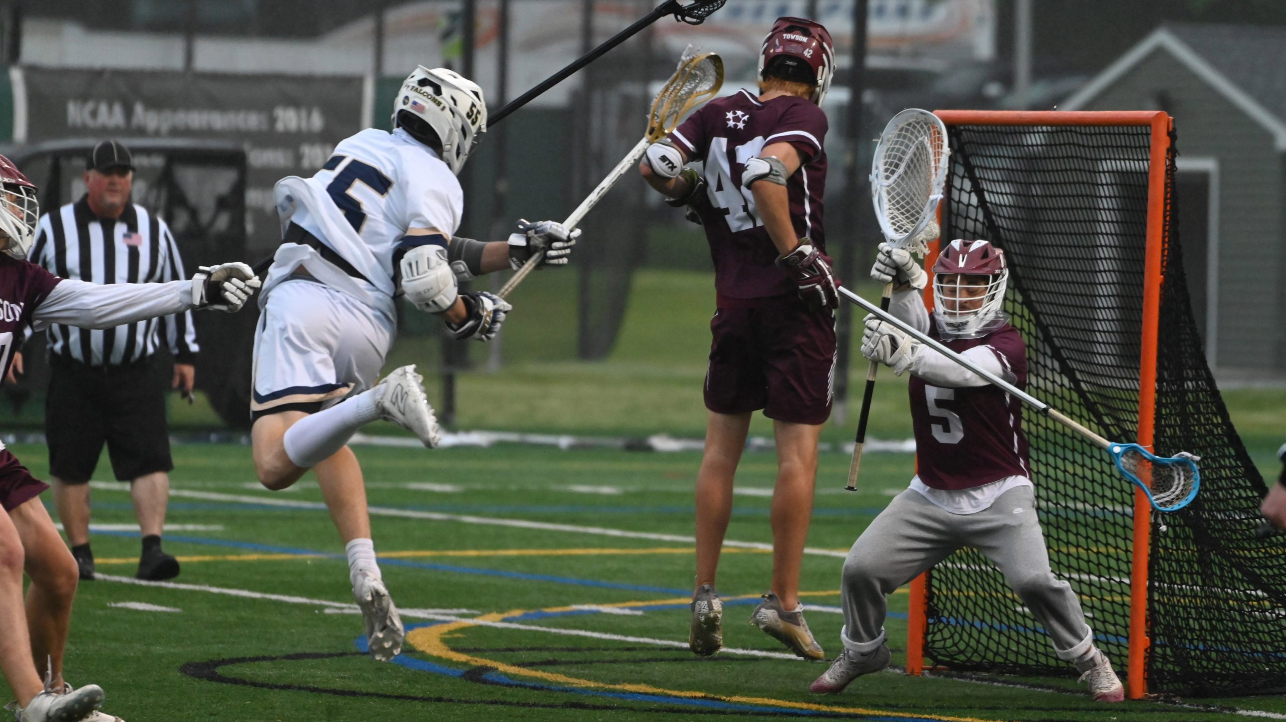 Severna Park’s Duke Sealey fires a shot as Towson goalie...