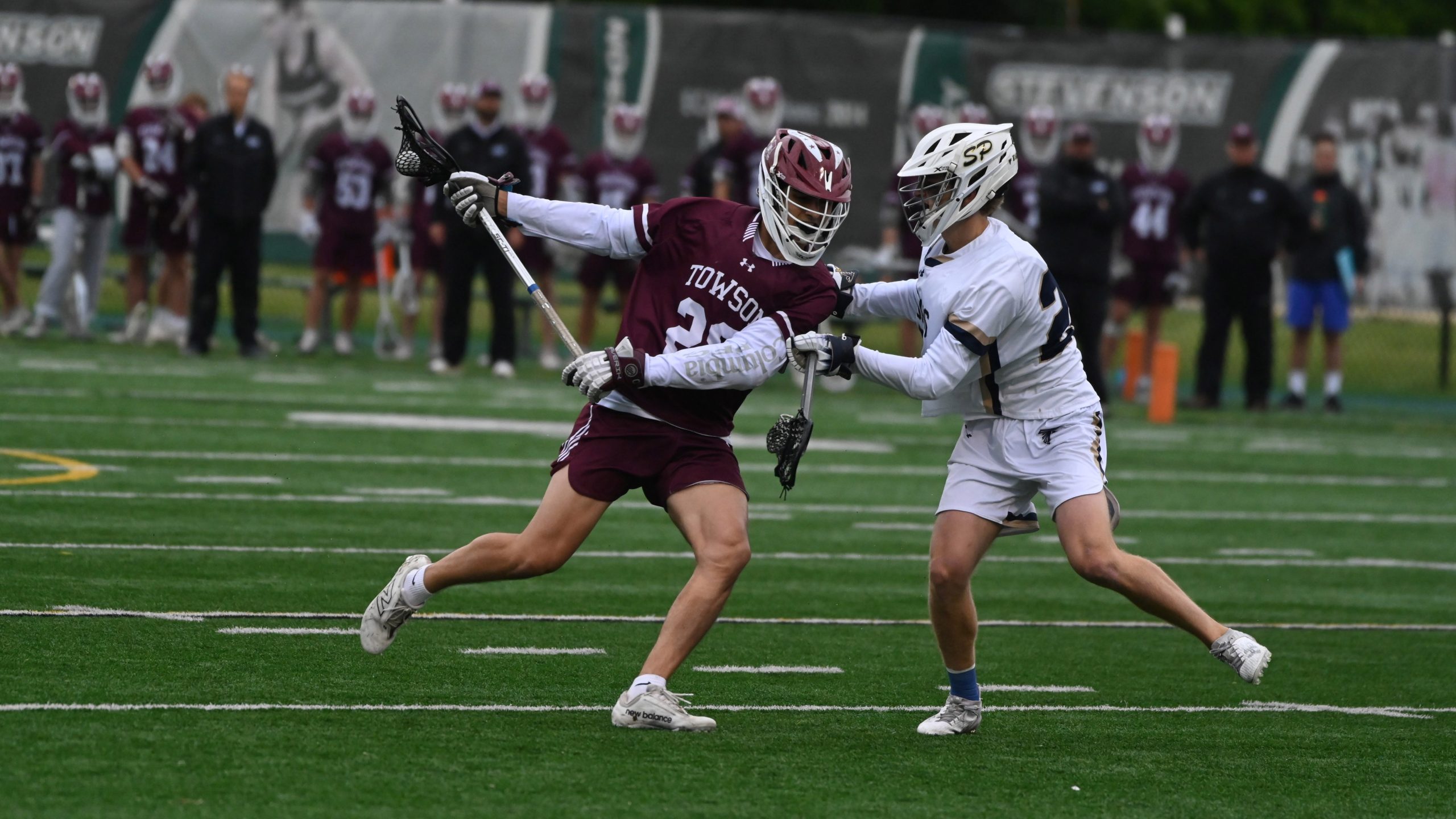 Towson’s Max Kosmides takes a check from Severna Park’s Dimitri...