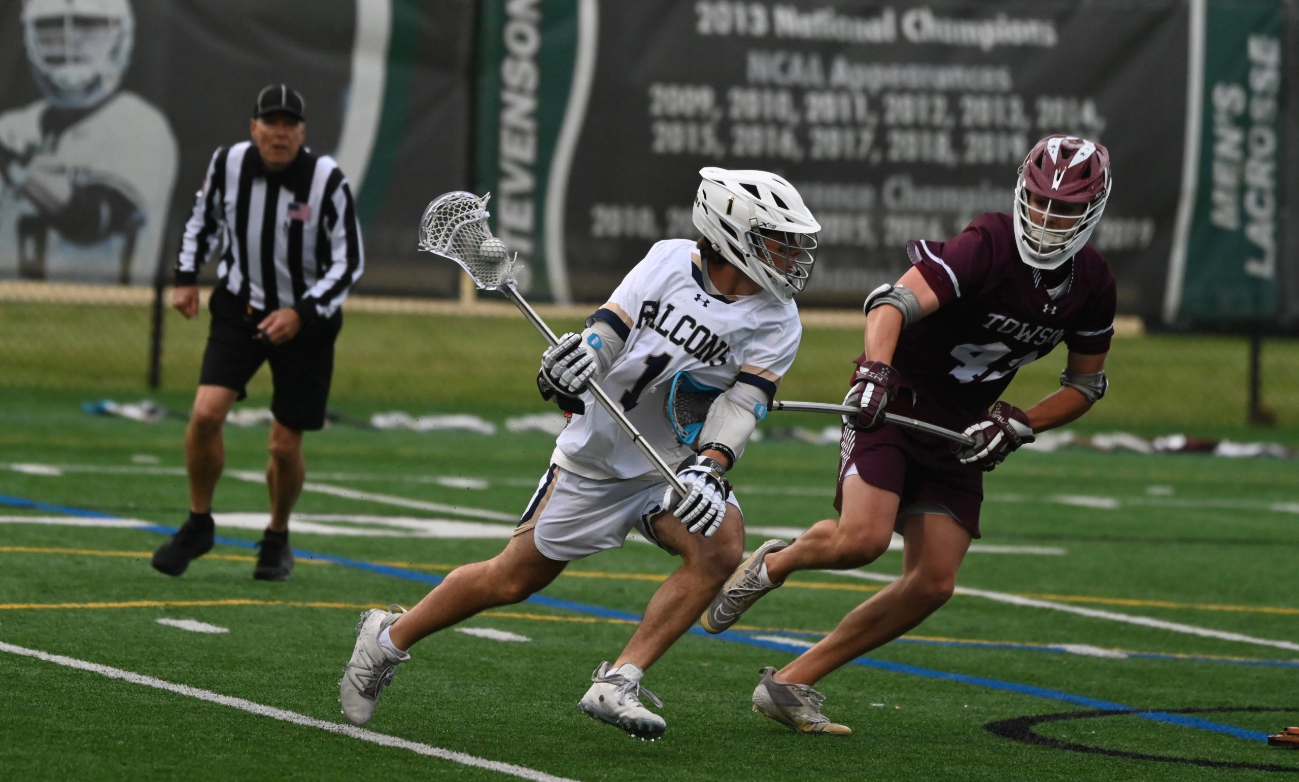 Severna Park’s Jack Fish moves with the ball, pressured by...