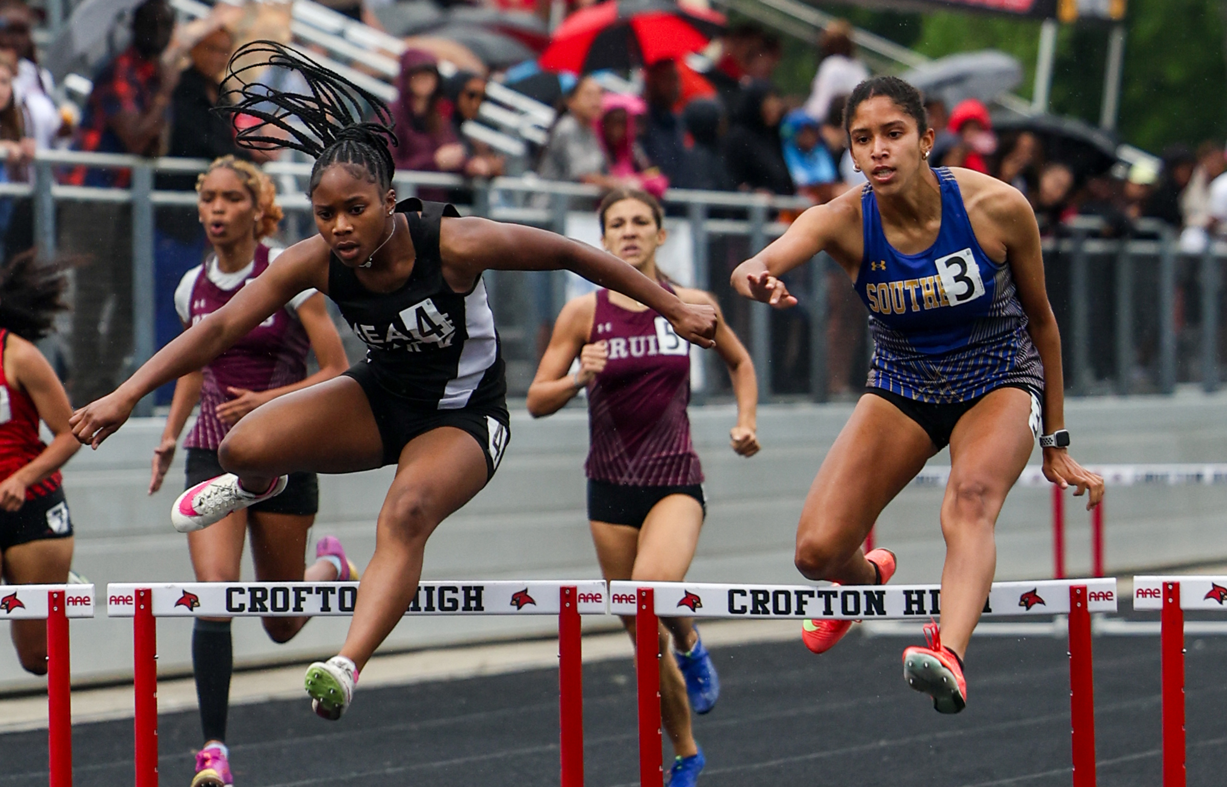 Marley Shaw, right, Southern girls wins 300m hurdles. Meade’s Jaslyn...
