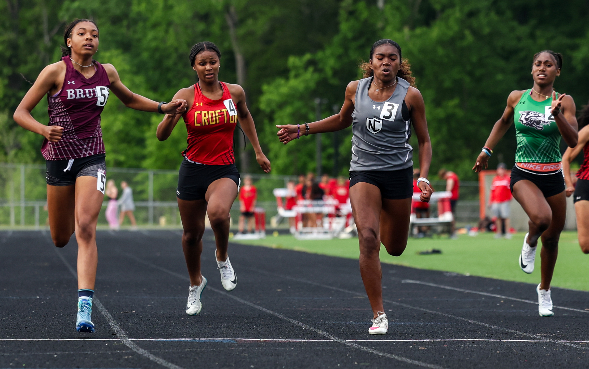 Ashtyn Coates, Broadneck, left, wins 200m, 24.81. North County Brianna...