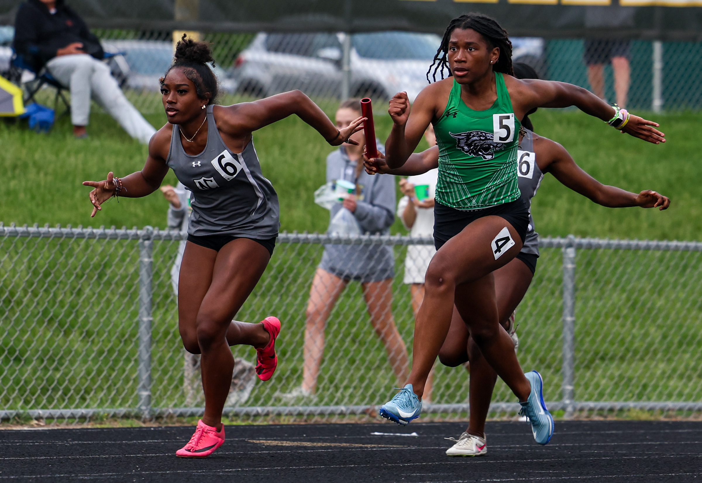 Aiyana Gutrick hands off to Calise White, North county, in...