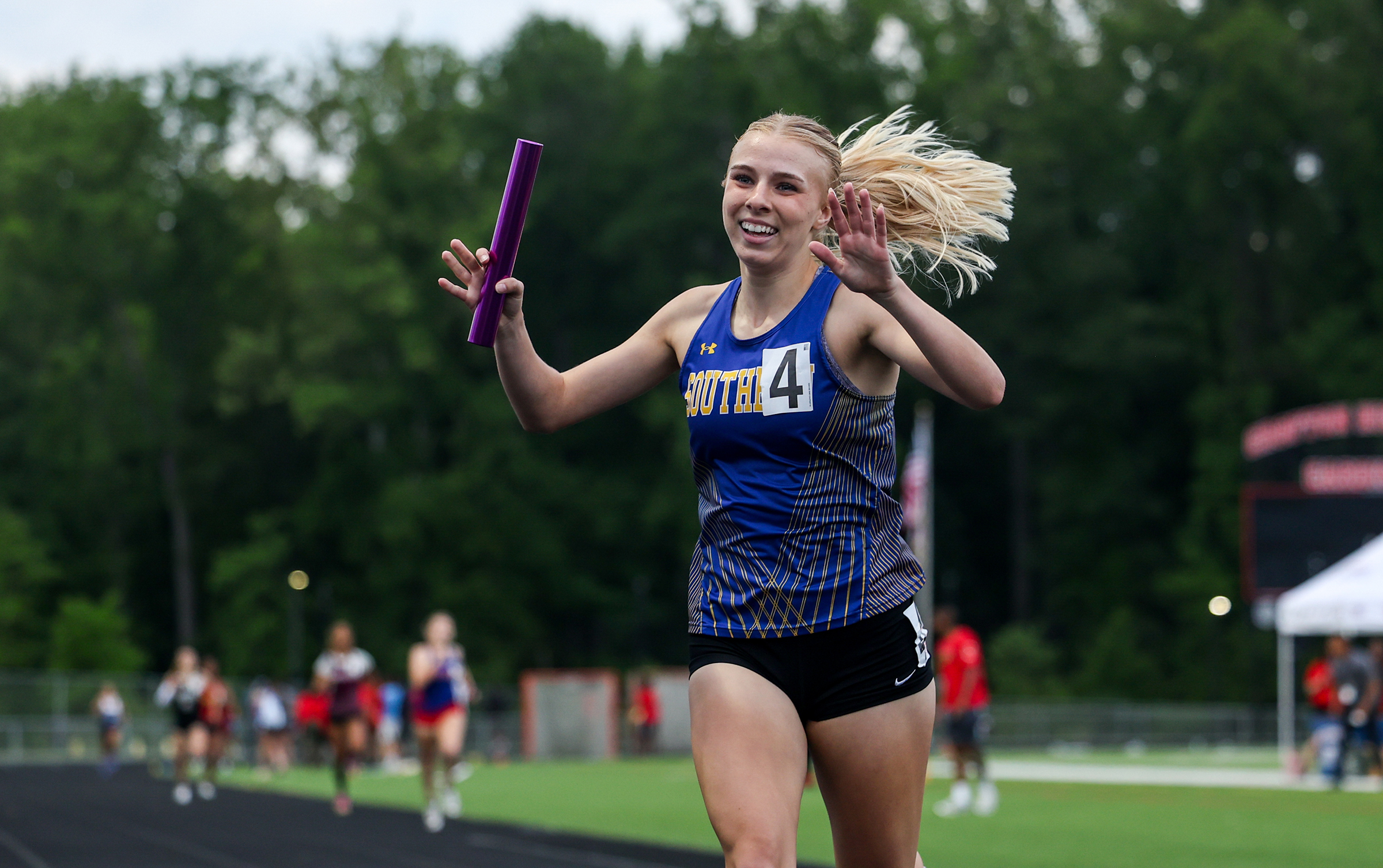 Rebecca Burgee, Southern, celebrates after winning 4x400mr. Anne Arundel County...