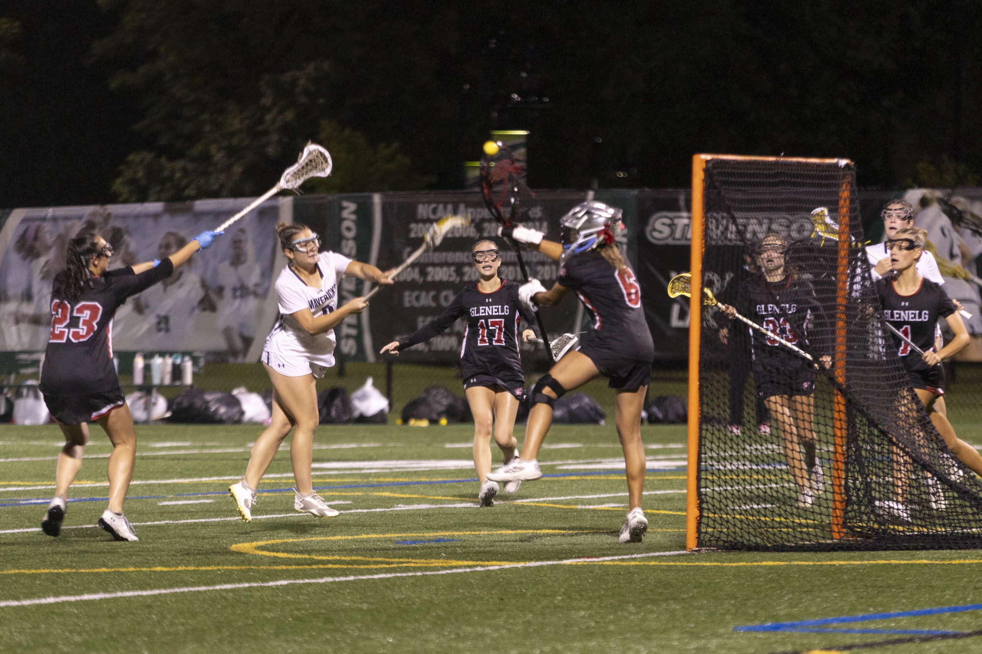 Manchester Valley’s Carolyn Lowe sneaks a shot past goaltender Eliza...