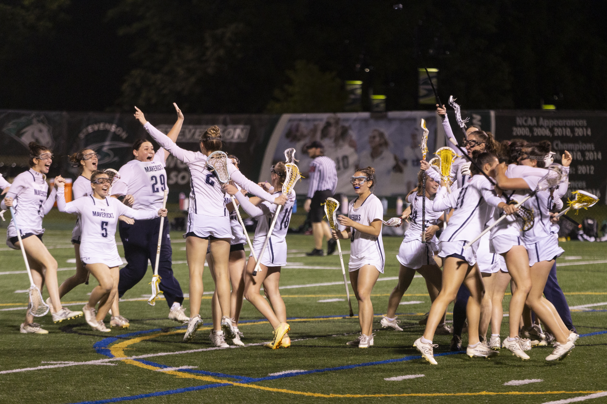 The Manchester Valley Mavericks rush the field after winning the...