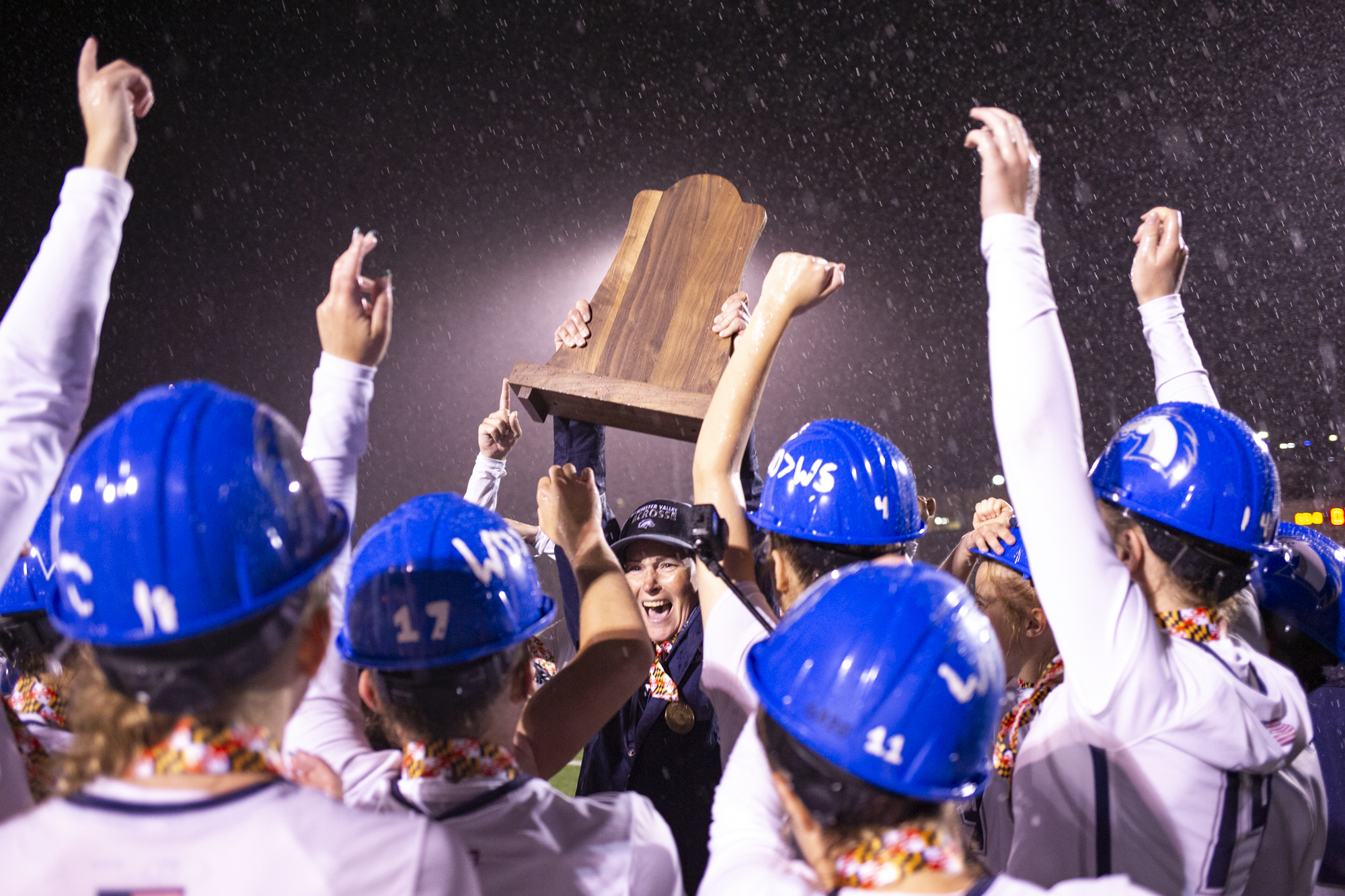 The Manchester Valley Mavericks celebrate their win with head coach...