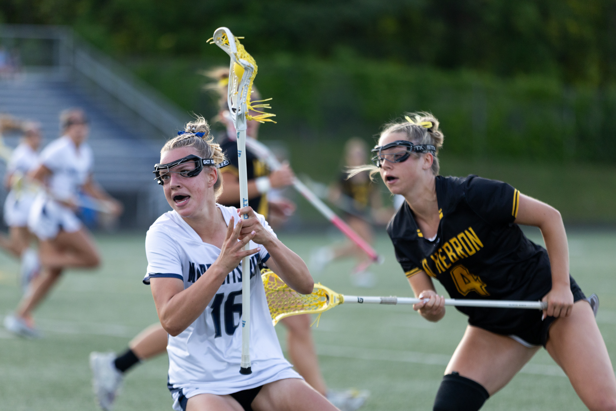 Jenna Cratin, left, avoids the defense of Kaitlyn Magdar during...