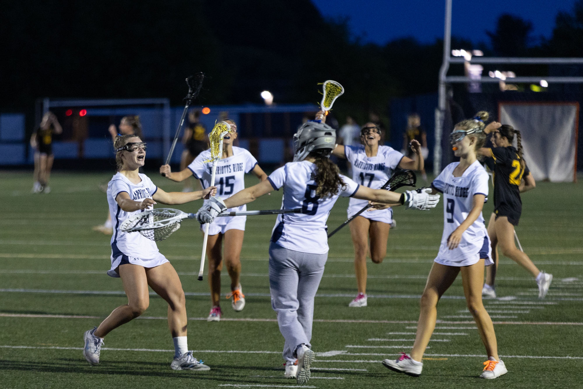 The Marriotts Ridge Mustangs rush the field after beating Mt....